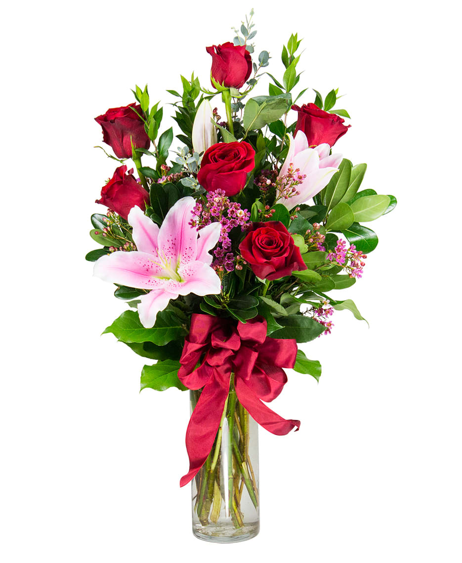 Amour - This Arrangement comes in a glass vase with 6 Red Roses, a stem of Stargazers, and using pink Wax / Green Fillers. *Note : If you want different color of roses, please Call us or send us a email. We'll be happy to accommodate you.*  NOT CAT FRIENDLY FLOWERS