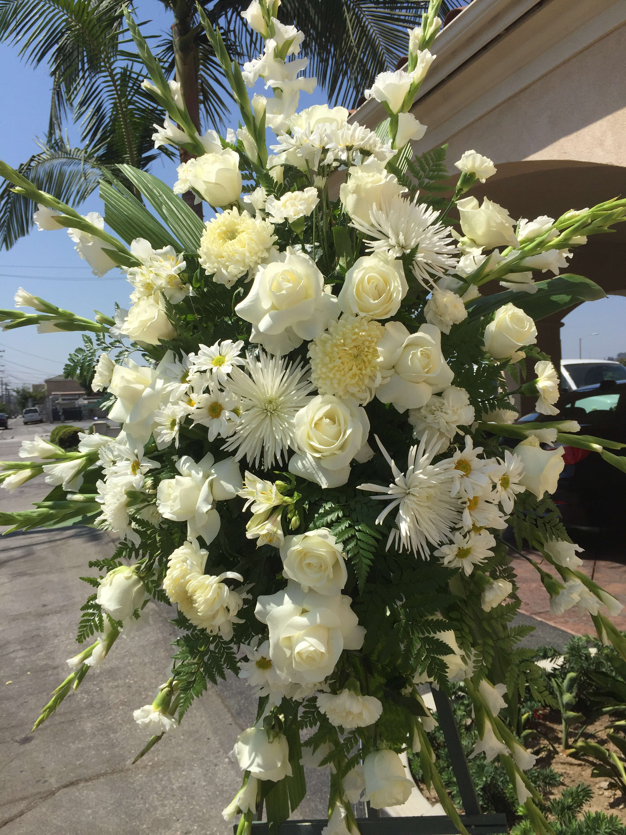 White Funeral Spray Arrangement - We can also make this Spray with any kind of Flowers/Colors. Please note, the picture shown is the Deluxe version.  *Order must be placed 2 - 3 days in advance* (Please note, same day pick-up or delivery is not available for this product) 