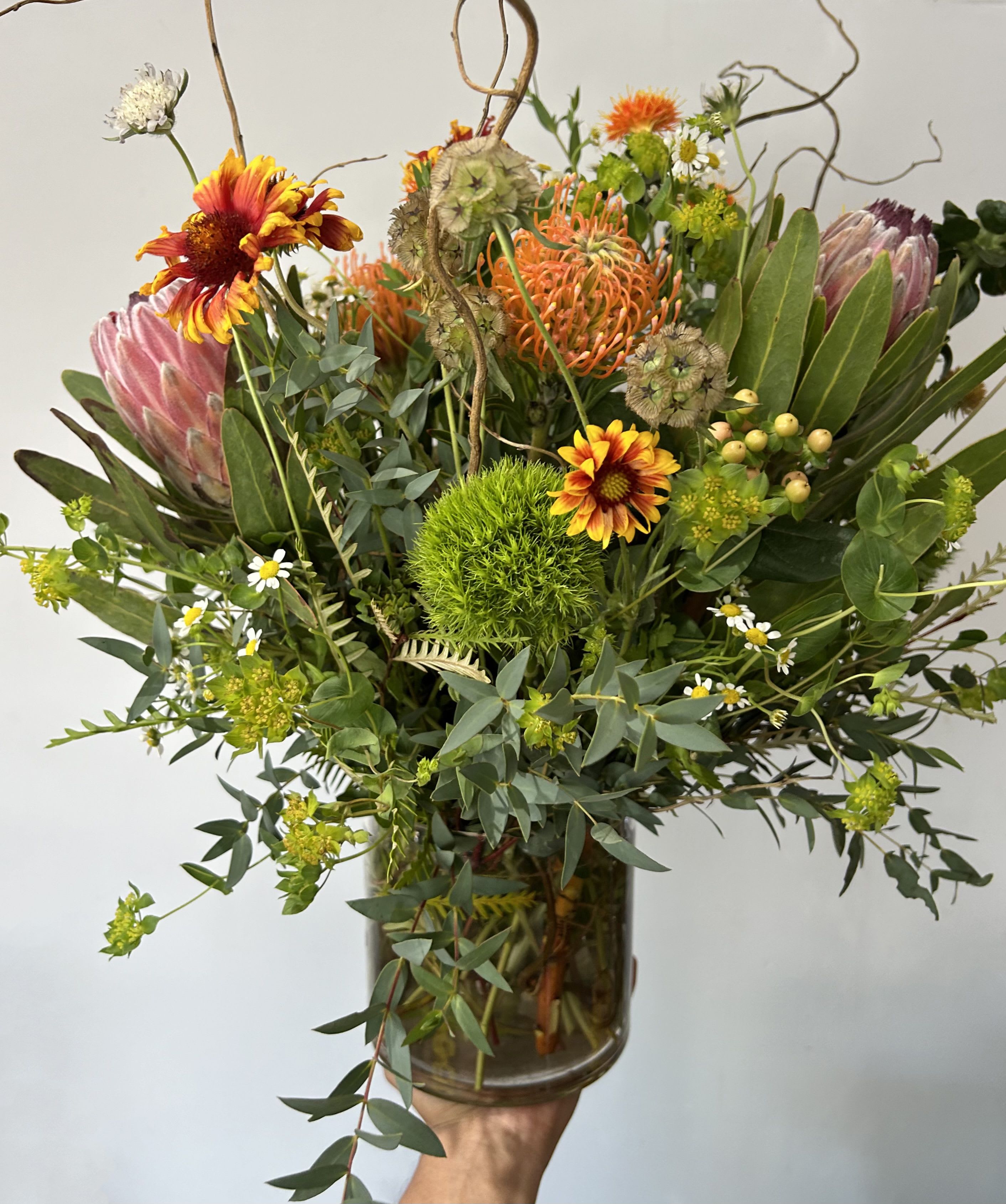 Rustic Garden  - Seasonal native rustic flowers arranged into a vase with fillers and greens. 