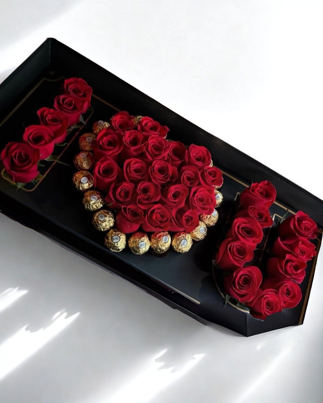 I love you box Deluxe - Introducing our Luxury I Love You Box. Representing Love…. This designs says everything on it. Enjoy Fresh Red Roses with this amazing creation just for you.   Red Roses and in a large big black box.  (Estimated 25 roses in this box)  
