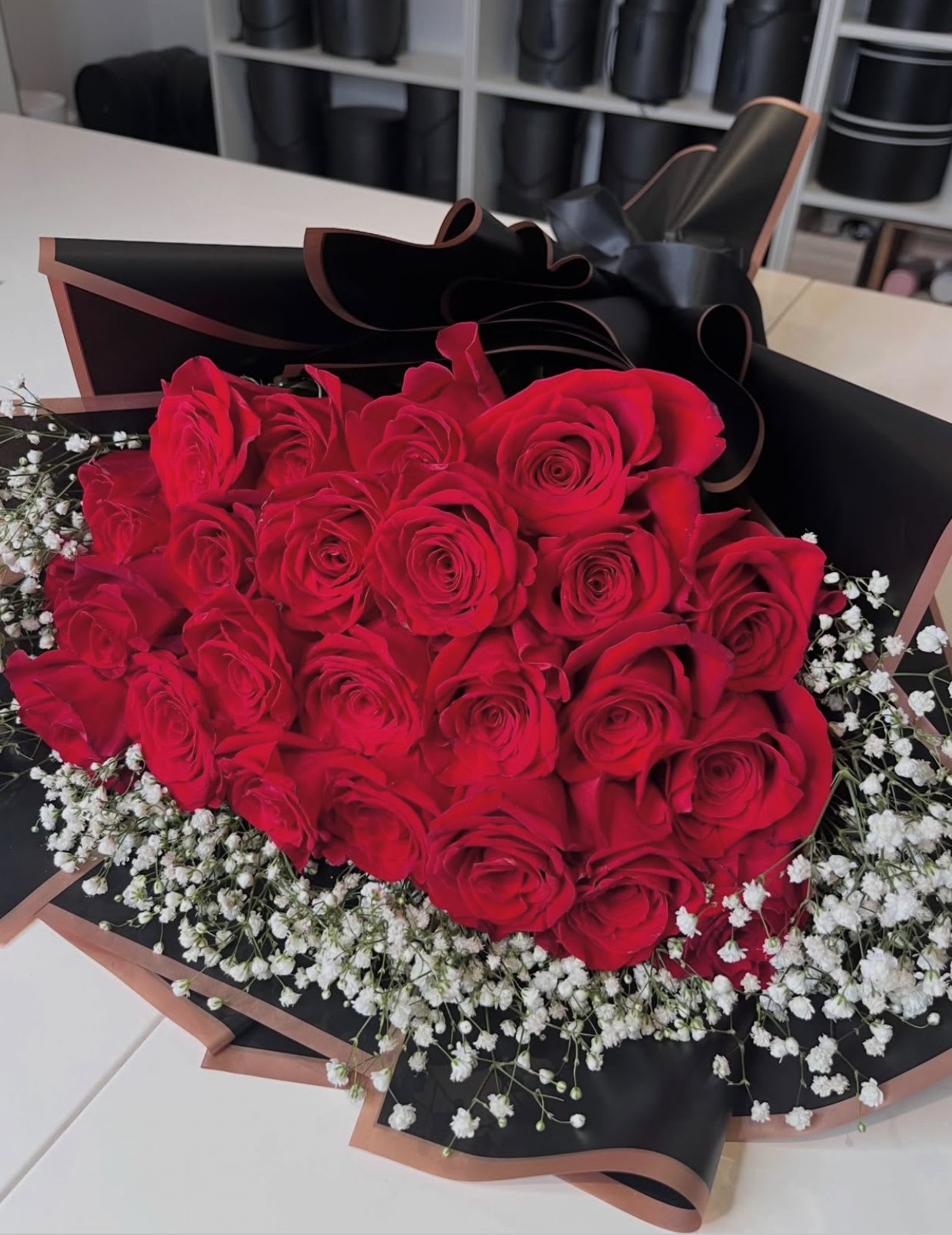 24 Roses Collection Flat bouquet  - A timeless flat bouquet featuring 24 premium roses paired with delicate baby’s breath, creating a soft and romantic look. Designed in our signature elegant wrapping, this bouquet is perfect for expressing love and appreciation.  Perfect for birthdays, anniversaries, or just because    Details: • 24 premium roses • Baby’s breath accents • Elegant flat bouquet style • Handcrafted design