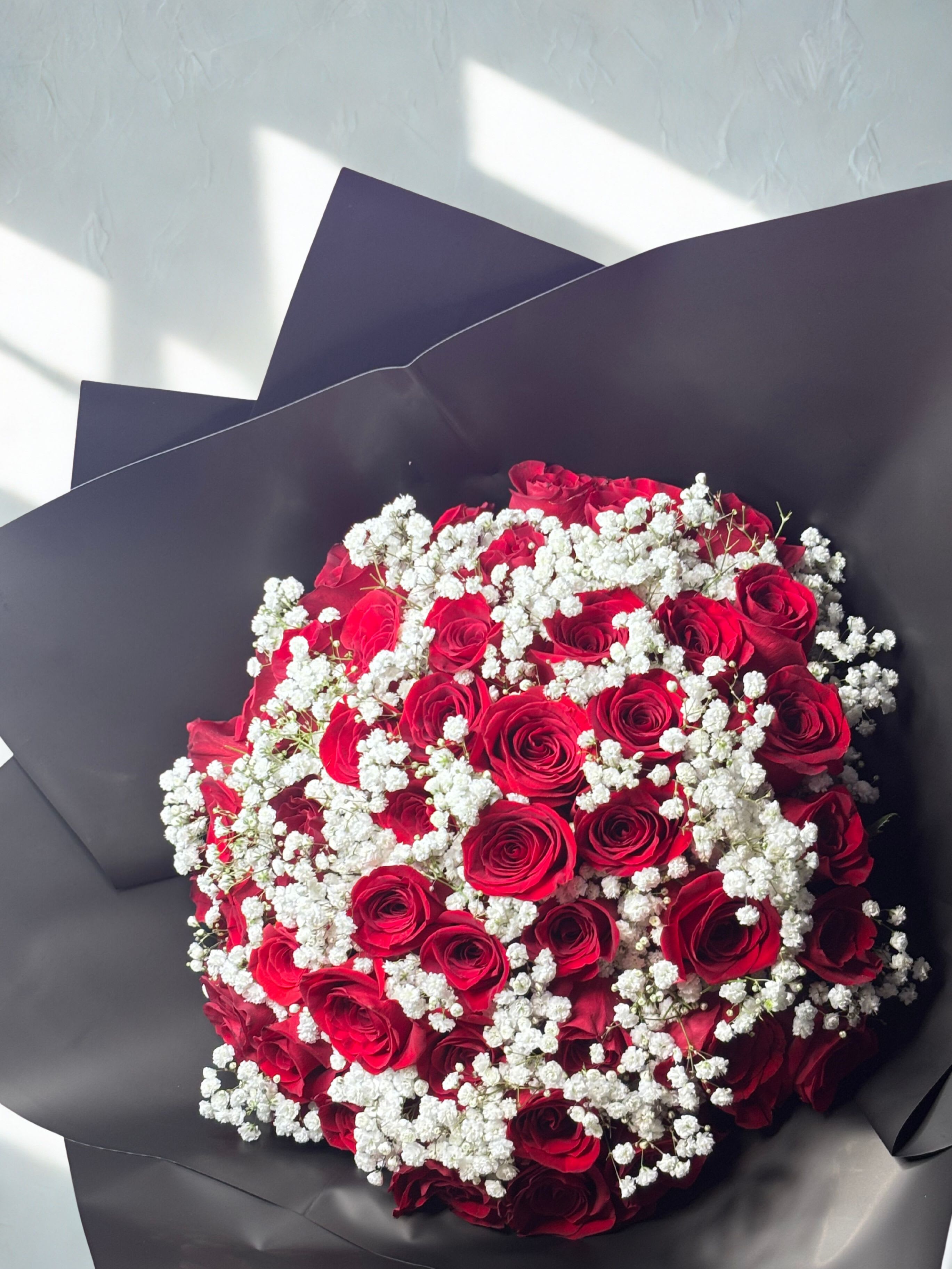 Large baby breath and roses - 40 fresh red hand-picked roses tied un in bouquet with baby breath   Handcrafted with love by Pétale de Rose  Same-day delivery available in Houston &amp; Katy