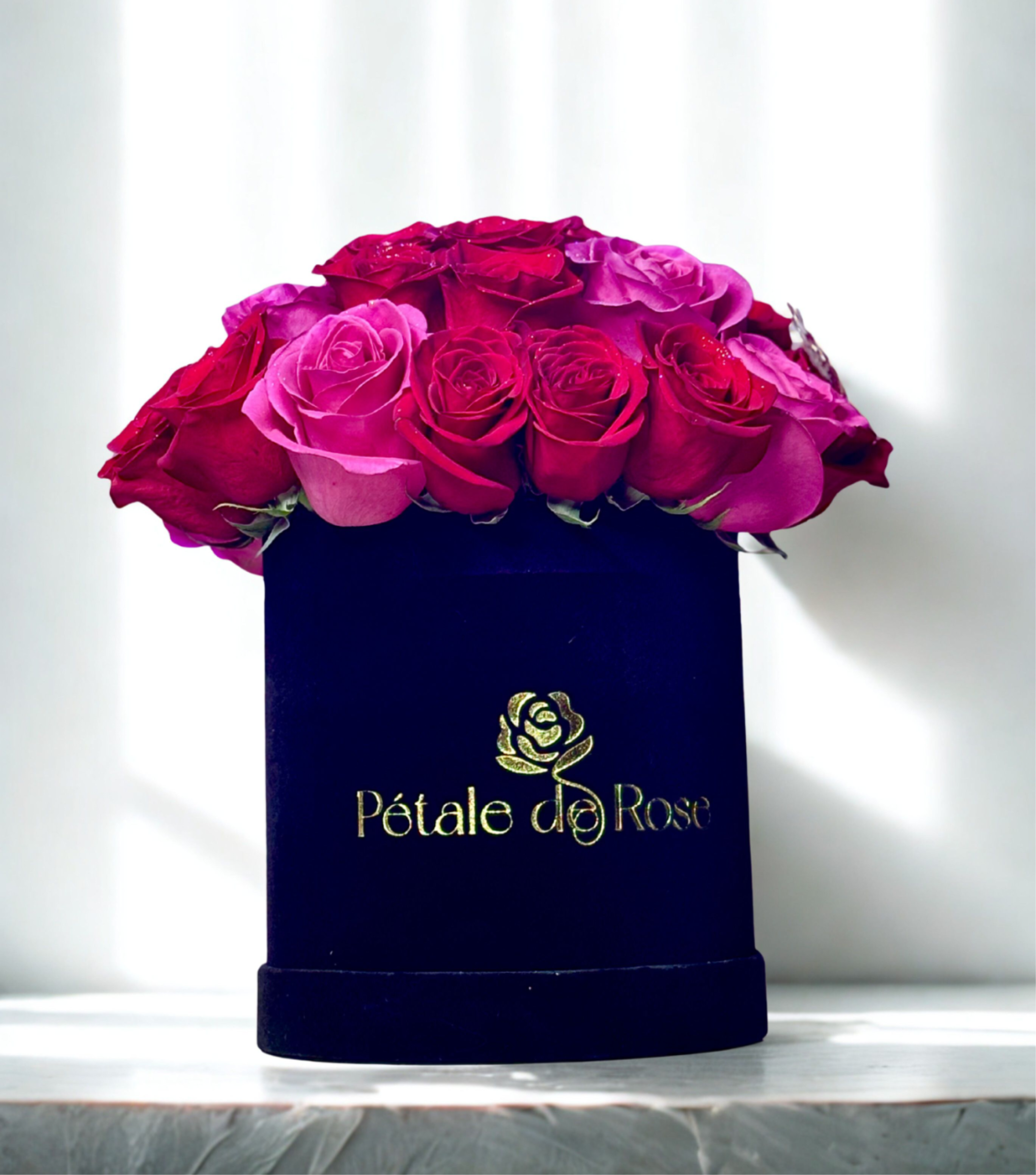 Pink and red small black box  - Enjoy our small velvet box with 24 fresh flowers  Red and pink combination for the roses  Surprise your loved one with flowers    Please be advised pink shade of the roses may vary based on season and availability 