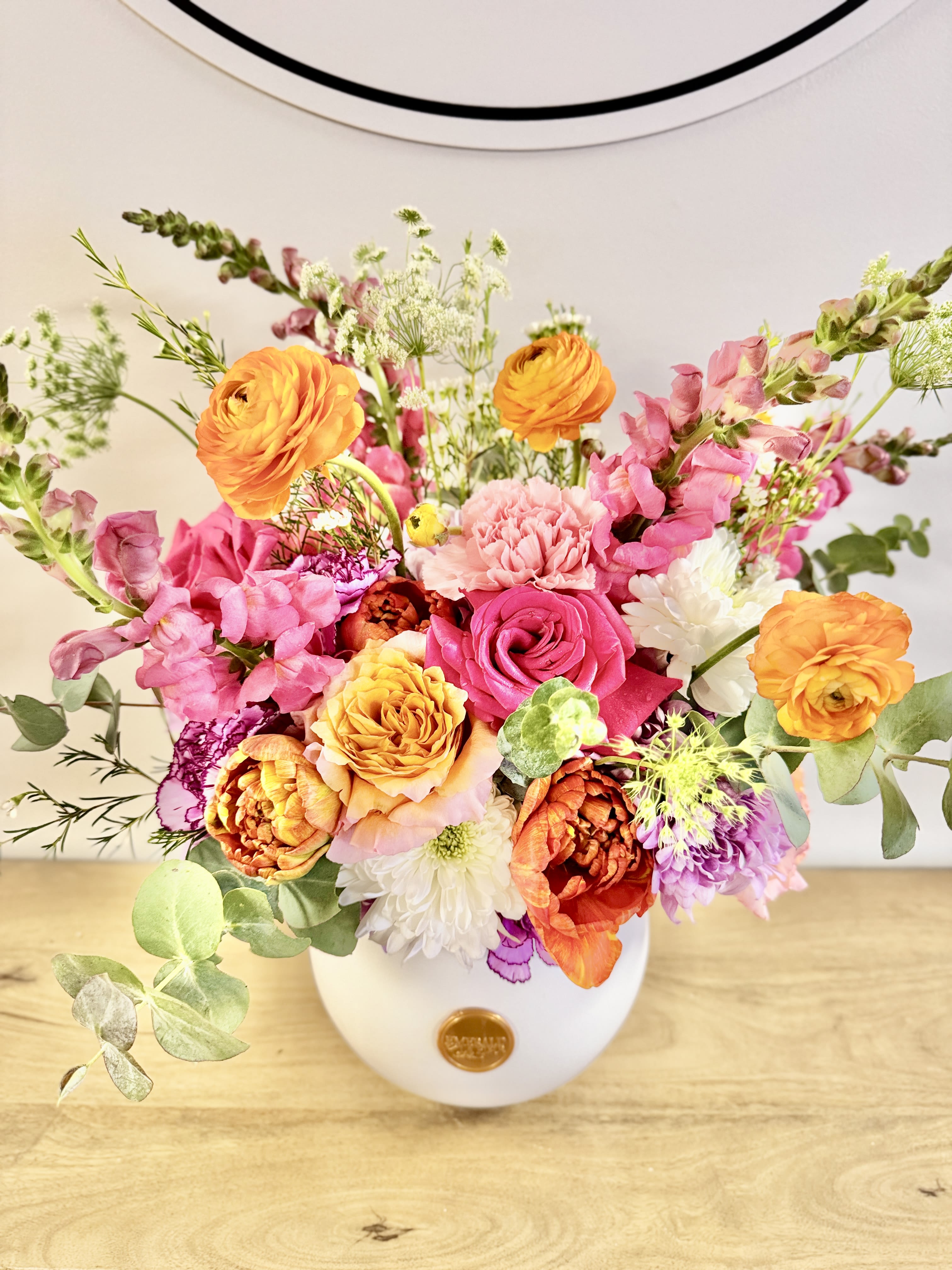 Spring Sonata - Celebrate the beauty of new beginnings with Spring Sonata—a stunning, large floral composition that harmonizes soft pastels with vibrant blooms. Accented by graceful flowering branches, this grand arrangement is perfect as a statement piece for a foyer or a spacious kitchen island. Whether as a thoughtful gift or a striking centerpiece, Spring Sonata brings elegance and the promise of fresh possibilities into any space.