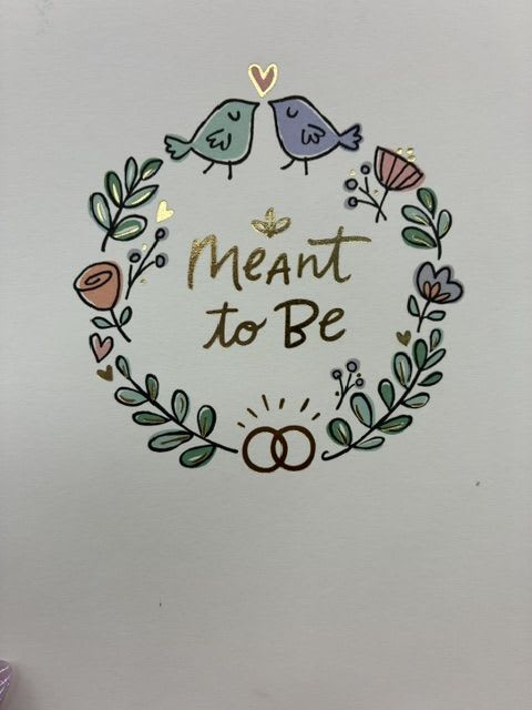 "Meant to Be" couple's card - A whimsical, romantic printed greeting card that says "Meant to Be" at its heart-perfect as a companion to a floral gift for anniversary, wedding, or a spontaneous love note. The hand-drawn wreath motif and two small birds create an intimate, storybook feel that makes the recipient feel seen and cherished; this is the kind of card that turns a bouquet into a meaningful moment for someone you adore or a couple you celebrate.  Soft pastel accents of yellow, green, blue, and pink circle the sentiment, with subtle gold detailing that catches the light and lifts the design. The handmade look of the florals and leaves keeps the tone warm and personal rather than formal, so it works equally well for anniversaries, saying "thinking of you," or as a tender "just because" note alongside wedding or romance gifts. Packaged with care, the card pairs beautifully with fresh sunflowers, mixed pastels, or any arrangement meant to say they're meant to be.