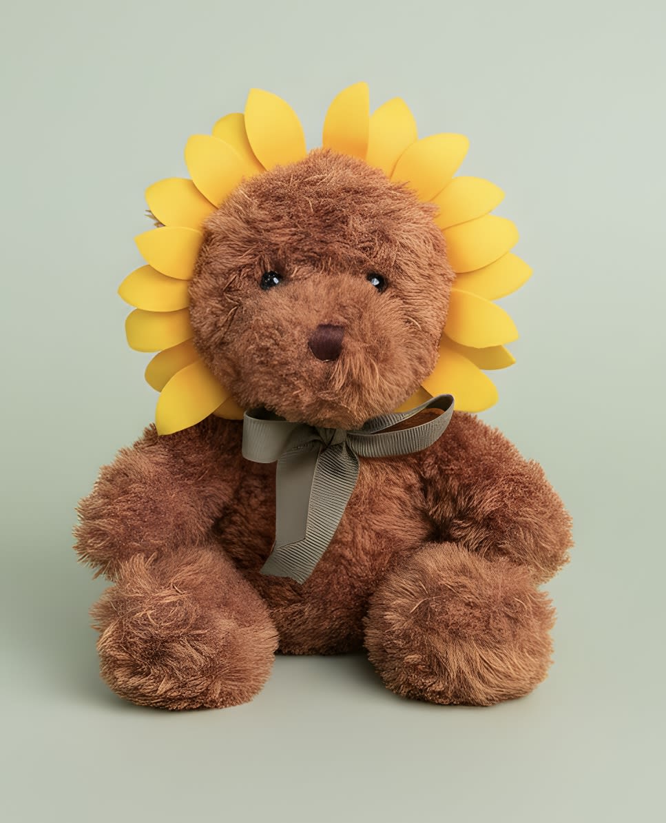 Sunflower Bear (*can add with any vase or gifting) - A plush brown teddy bear styled like a sunflower makes a playful, cheerful gift for someone who needs a smile - perfect as a get well, just because, or thinking of you present. This flower arrangement alternative blends the warmth of a classic stuffed animal with floral charm, so it also reads as a sweet birthday, new baby, or thank-you gesture and can carry romantic intent for love and romance or Valentine's Day when paired with roses.  The bear wears a bright yellow petal-like collar that frames its face like a sunflower, a soft gray ribbon tied at the neck, and a decorative flower collar for added texture and charm. Colors include warm brown with pops of yellow, plus coordinating whites, pinks, reds, and other accent hues when combined with any vase or floral add-on. The soft plush makes it cuddly and long-lasting compared with cut flowers.  Give the person you're thinking of something that feels both thoughtful and fun - the kind of gift that comforts and delights. This piece can be added to any vase or paired with mixed daisies and roses to tailor the message: celebratory for birthdays and congrats, tender for new parents or a romantic note, and comforting for get well wishes. Care is simple - spot-clean the plush and enjoy a gift that keeps giving beyond the first bloom.