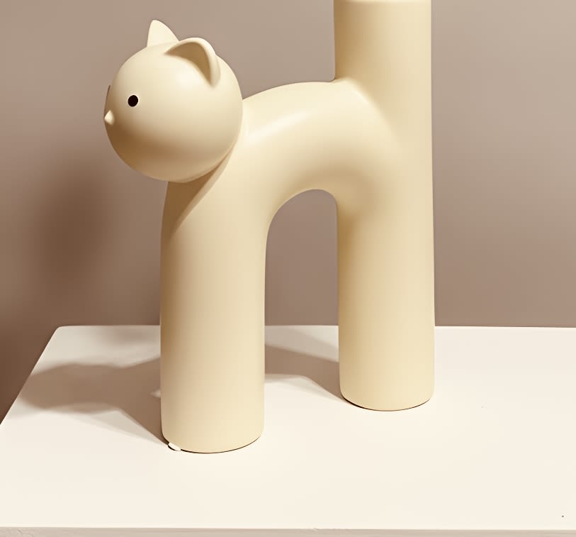 Cat lover's vase with flower options (* sunflowers, Dahlias or wildflowers mix)  - A whimsical cream cat sculpture paired with fresh flowers makes an instantly charming gift for the person who adores feline company-perfect as a birthday bouquet, housewarming arrangement, or a "just because" surprise. This flower arrangement for cat lovers blends a modern, minimalist decorative sculpture with your choice of sunflowers, dahlias, or a wildflower mix to create a joyful, personal presentation that will make the recipient feel noticed and delighted.  Choose sunflowers for sunny cheer, dahlias for rich texture and elegance, or a wildflower mix for a relaxed, garden-fresh look; each option is arranged to complement the soft white, matte-finish cat vase so the colors sing against a neutral backdrop. The sculpture's rounded, playful silhouette and upright tail create a calm, contemporary focal point on a mantel, entry table, or bedside. This is the kind of gift that says "I saw something that fit you"-order with preferred flower option at checkout; stems come arranged for immediate display and simple water care instructions are included so the recipient can enjoy blooms longer.