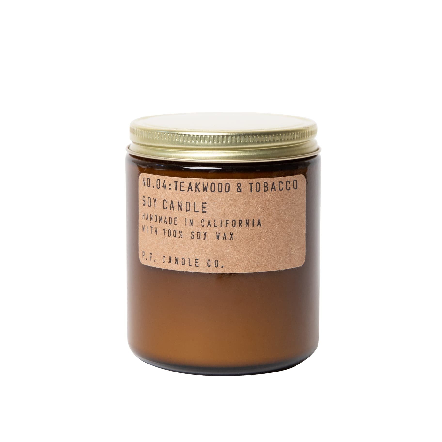Brown glass jar candle with a gold lid and paper label
