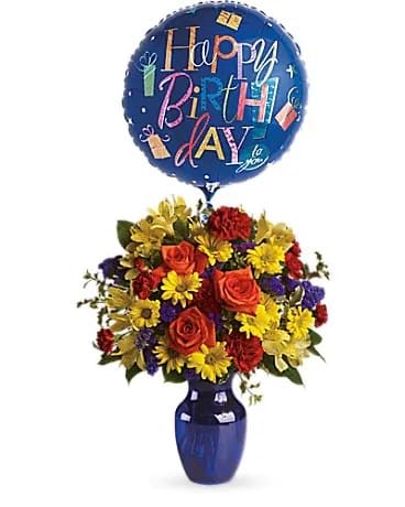 Fly Away Birthday Bouquet - Make birthday spirits soar by sending this fabulously fun birthday bouquet and balloon. Bright primary colors make it perfect for guys and gals. Years may fly by but that doesn't mean birthday celebrations need to! Brilliant orange roses, yellow alstroemeria, red carnations and miniature carnations, yellow daisy spray chrysanthemums, purple statice and a big bright balloon are all delivered in a beautiful cobalt blue vase. It's a thumbs-way-up choice in birthday gifts!