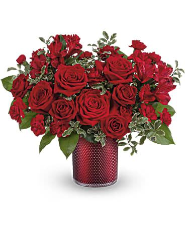 Red roses arranged in a red textured vase