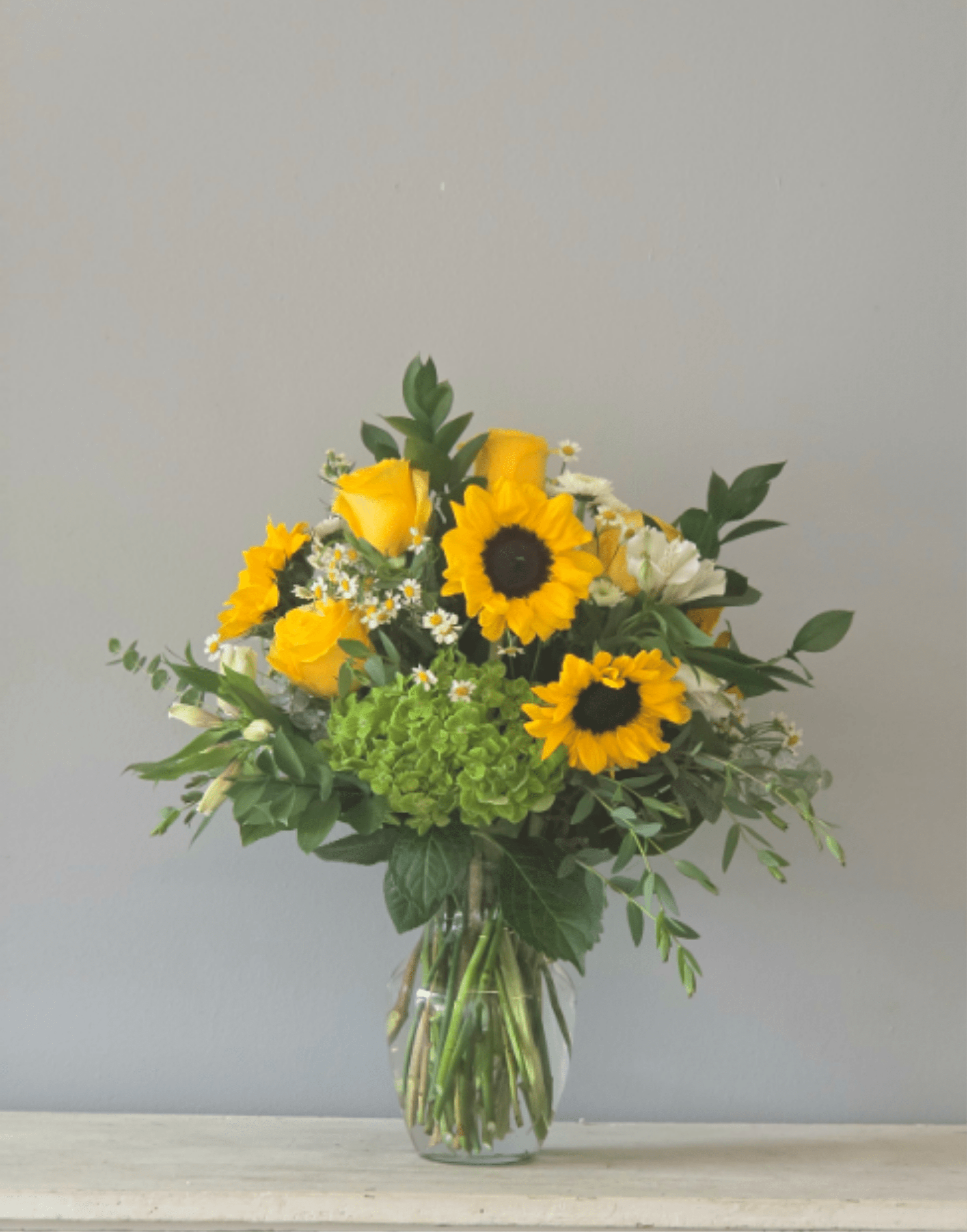 Sunshine and Smiles - A vase of sunflowers and roses with white accents