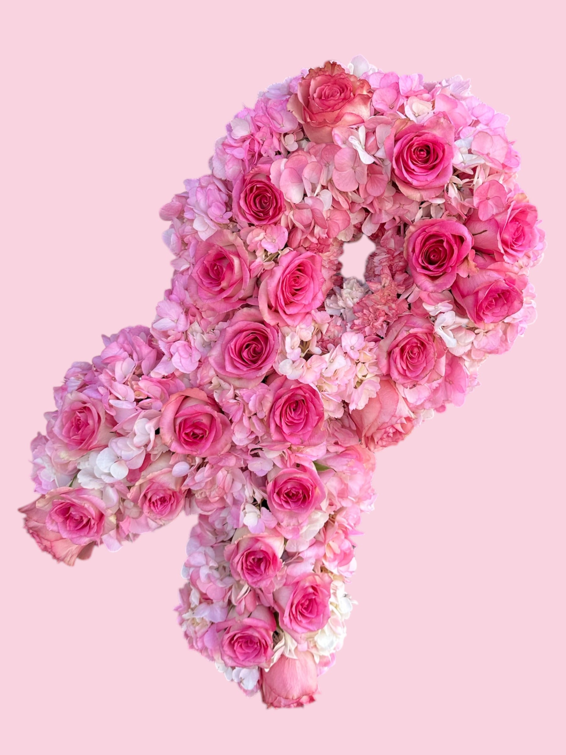 Pink rose and hydrangea floral arrangement shaped like a number 4