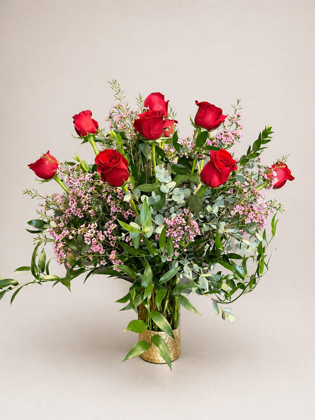 Elegant Dozen Roses - 12 long stem red roses arranged in a designer gold bottomed vase with premium greenery and filler for the extra elegant and classy look