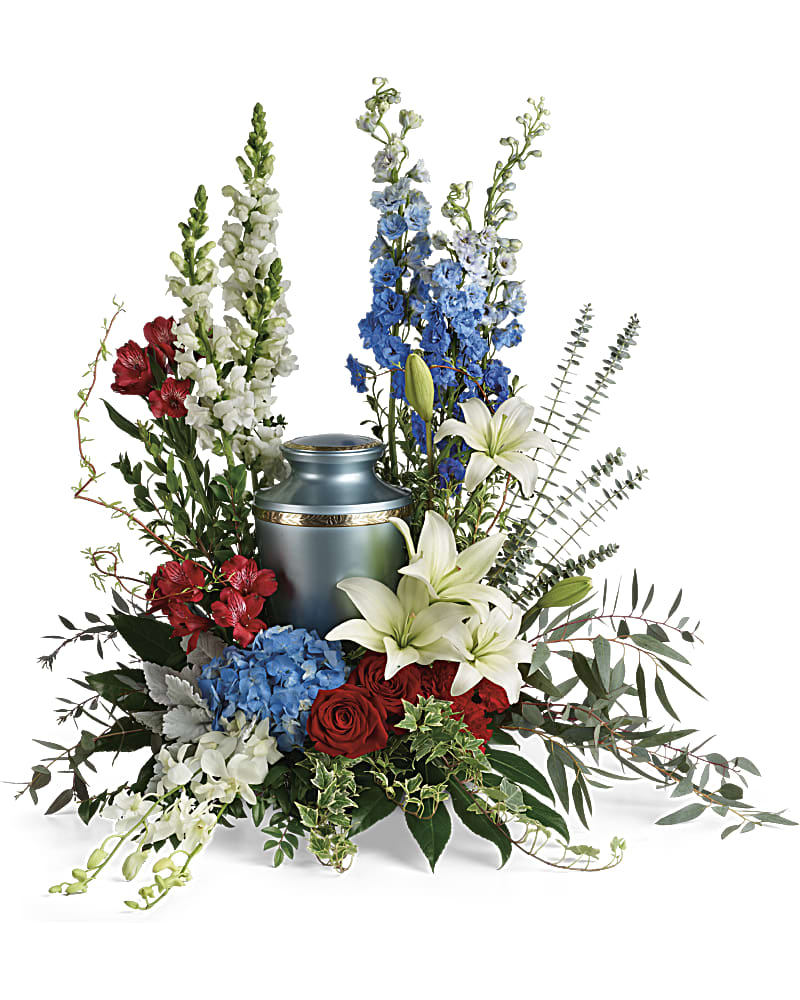 Reflections Of Honor Cremation Tribute - Proud and patriotic, this boldly designed red, white and blue bouquet displays the cremation urn with honor. This patriotic tribute includes blue hydrangea, white dendrobium orchids, red roses, white asiatic lilies, red alstroemeria, red carnations, blue delphinium, white snapdragons, dusty miller, myrtle, huckleberry, variegated ivy, curly willow, aralia leaves, parvifolia eucalyptus, spiral eucalyptus, and lemon leaf. Arrangement does not include urn.