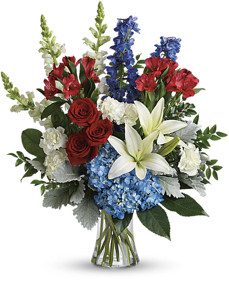 Colorful Tribute Bouquet - Perfectly patriotic with its red, white and blue blooms, this bold bouquet of hydrangea, lilies and roses is a versatile tribute on any occasion. This bouquet features blue hydrangea, red roses, white asiatic lilies, red alstroemeria, white carnations, blue delphinium, white snapdragons, huckleberry, dusty miller, aralia leaf and lemon leaf. Delivered in a gathering vase.