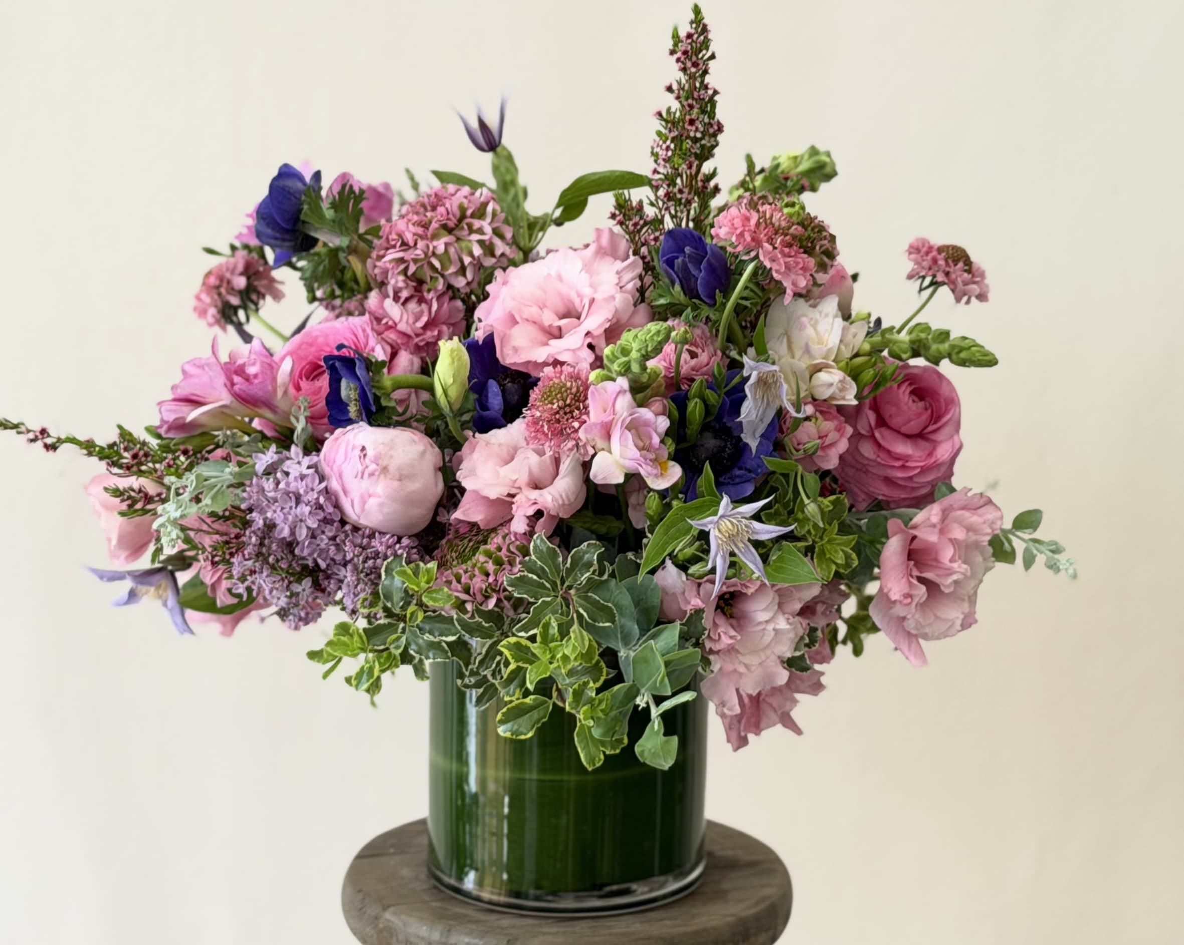 The say Hello to your new, little friend arrangement. - The chicest way to send a not-so-overwhelming Arrangement to that Special Someone.  Divine City!  Note: Seasonal Flowers will be used to replace those not in season.  Like Poppies, for example. Regardless, we will stun you.