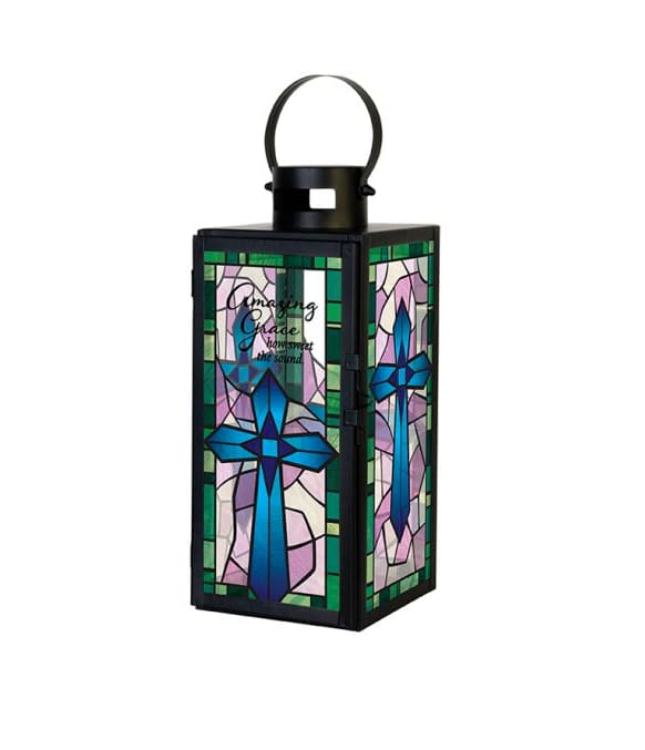 Black metal lantern with stained glass cross design and Amazing Grace text in blue, green, and lavender tones