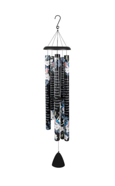 Black metal wind chime with floral pattern and script text on the tubes
