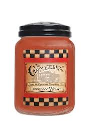 Orange candle jar with a black lid and checkered label
