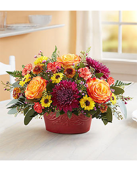 AUTUMN GATHERING CASSEROLE Dish Arrangement - We’ve cooked up a wonderful, all-in-one gift for all their autumn gatherings. Created exclusively through our collaboration with Pfaltzgraff™, this unique gift combines a vibrant arrangement with a versatile entertaining piece. They’ll love admiring the fall-toned blooms, then using the crimson-colored casserole dish over and over, which lets them simply cook, serve, save and enjoy! It’s an everything-safe bake ware essential that can be used for years to come