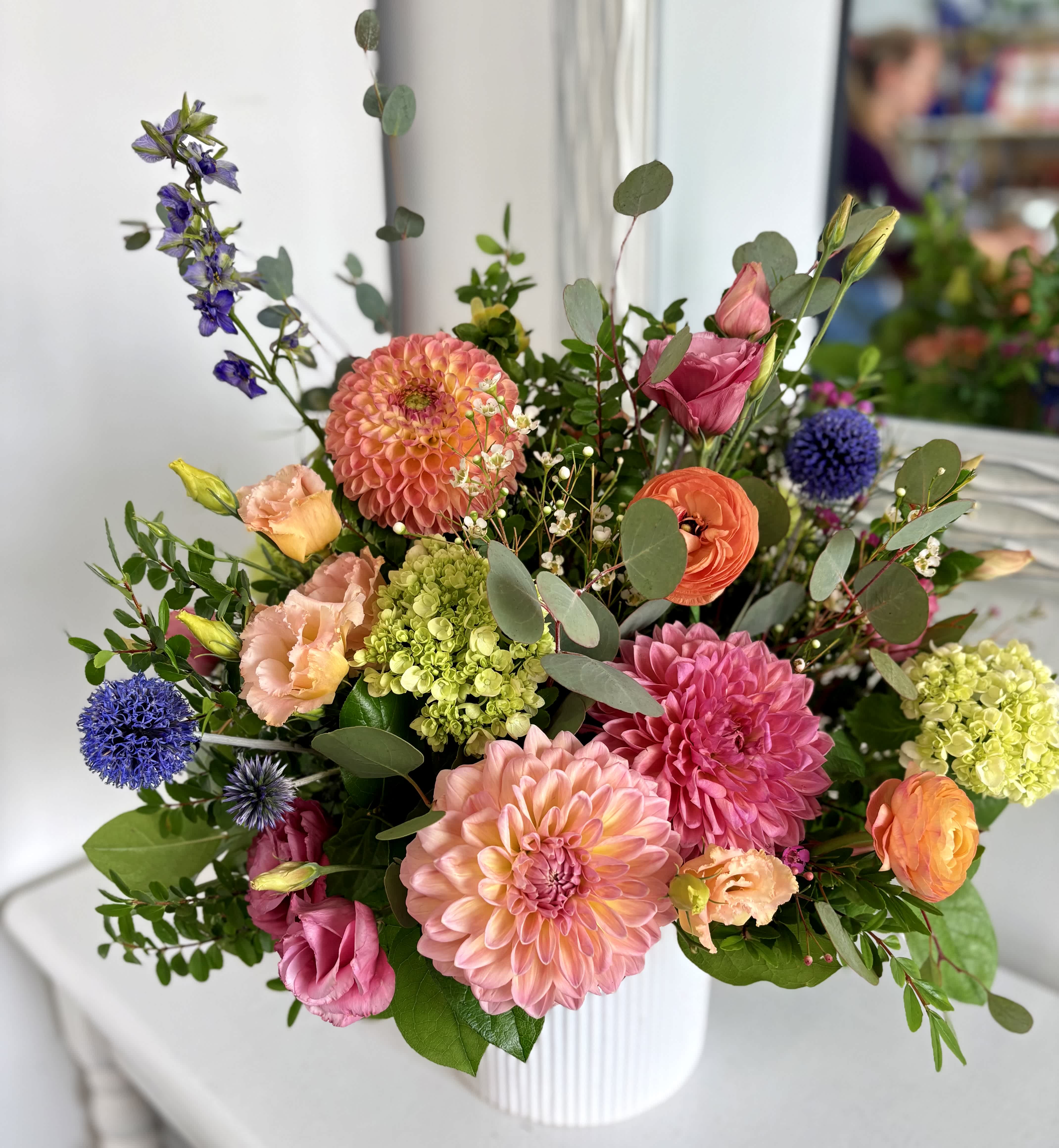 Colorful mixed bouquet in a white ribbed vase