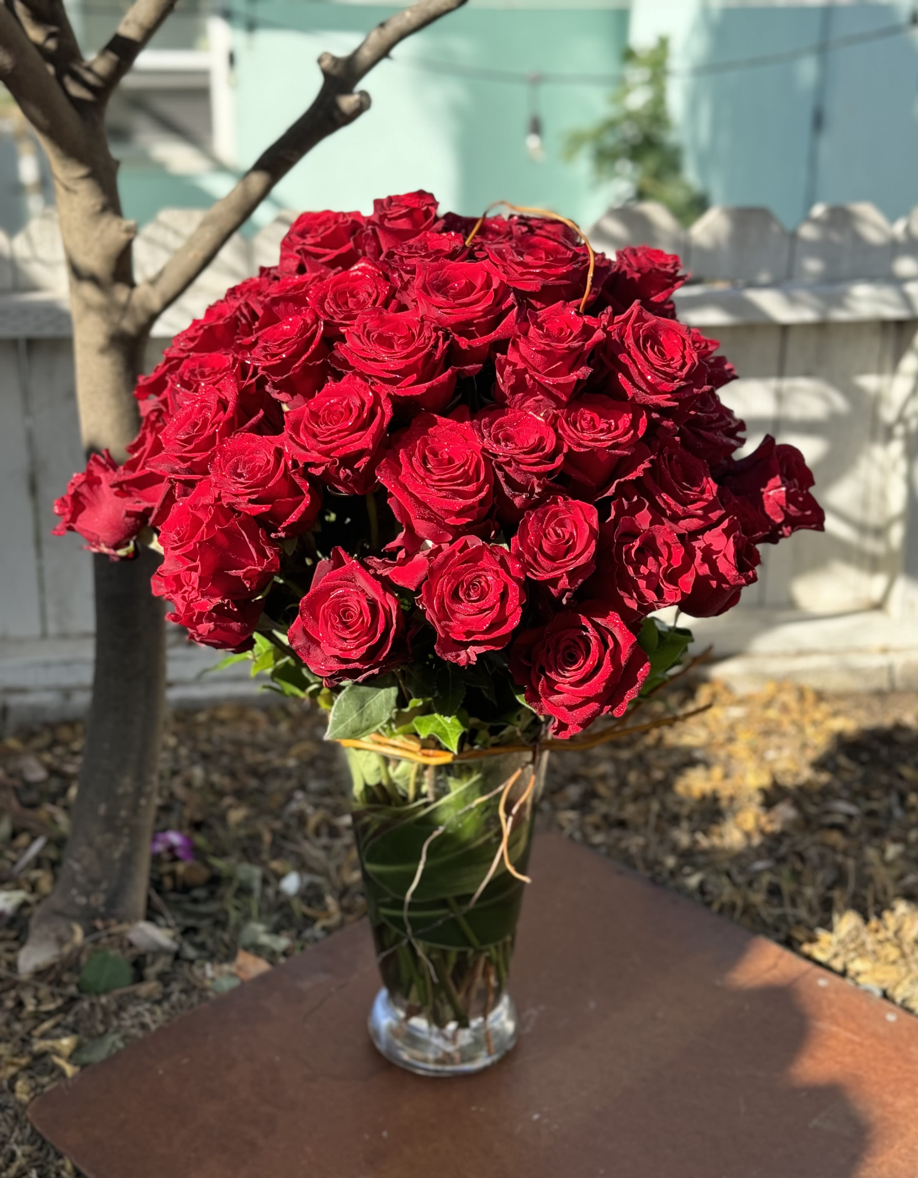 Bouquet of red roses in a clear glass vase