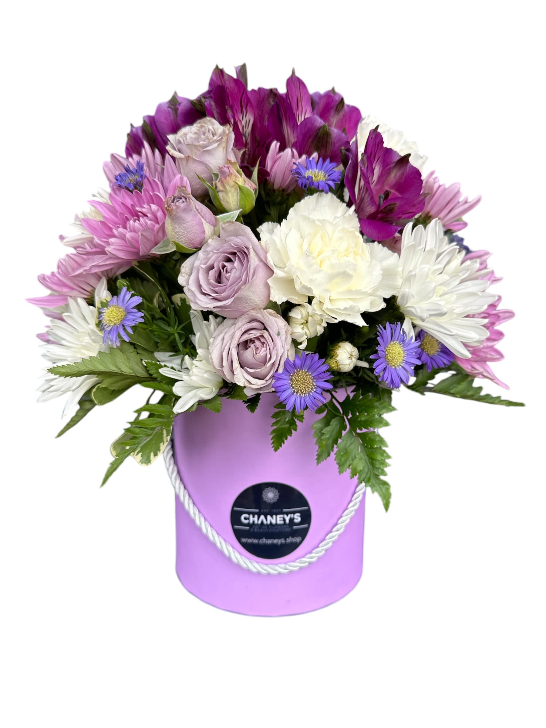 Lavender and white bouquet in a purple hatbox