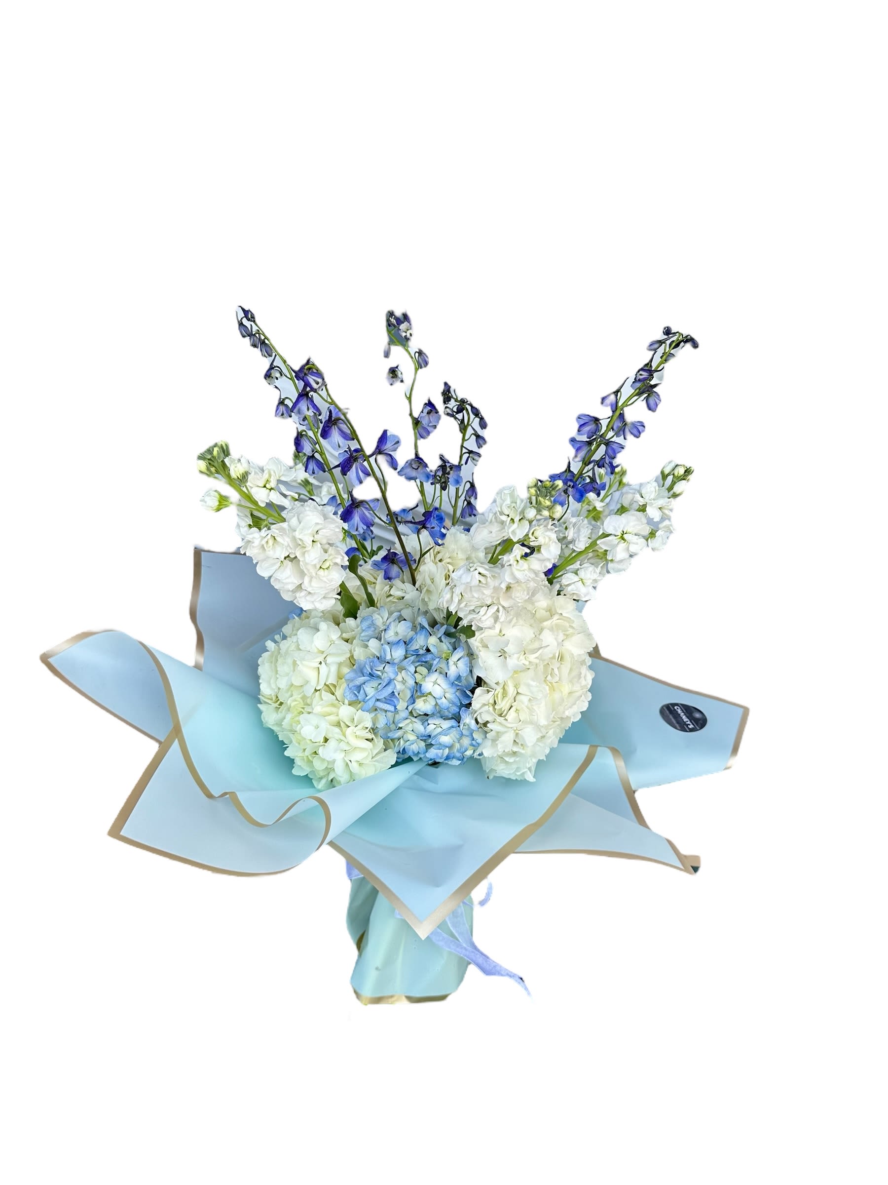 Bouquet of white and blue flowers wrapped in light blue paper