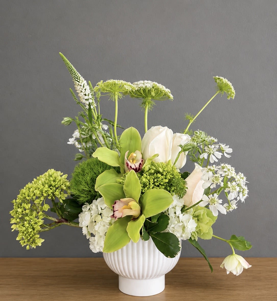 Lime &amp; Lace - A crisp, contemporary arrangement in a palette of fresh greens and soft whites. Textural blooms, airy flowers, and elegant orchids come together for a look that feels modern, refined, and effortlessly beautiful.