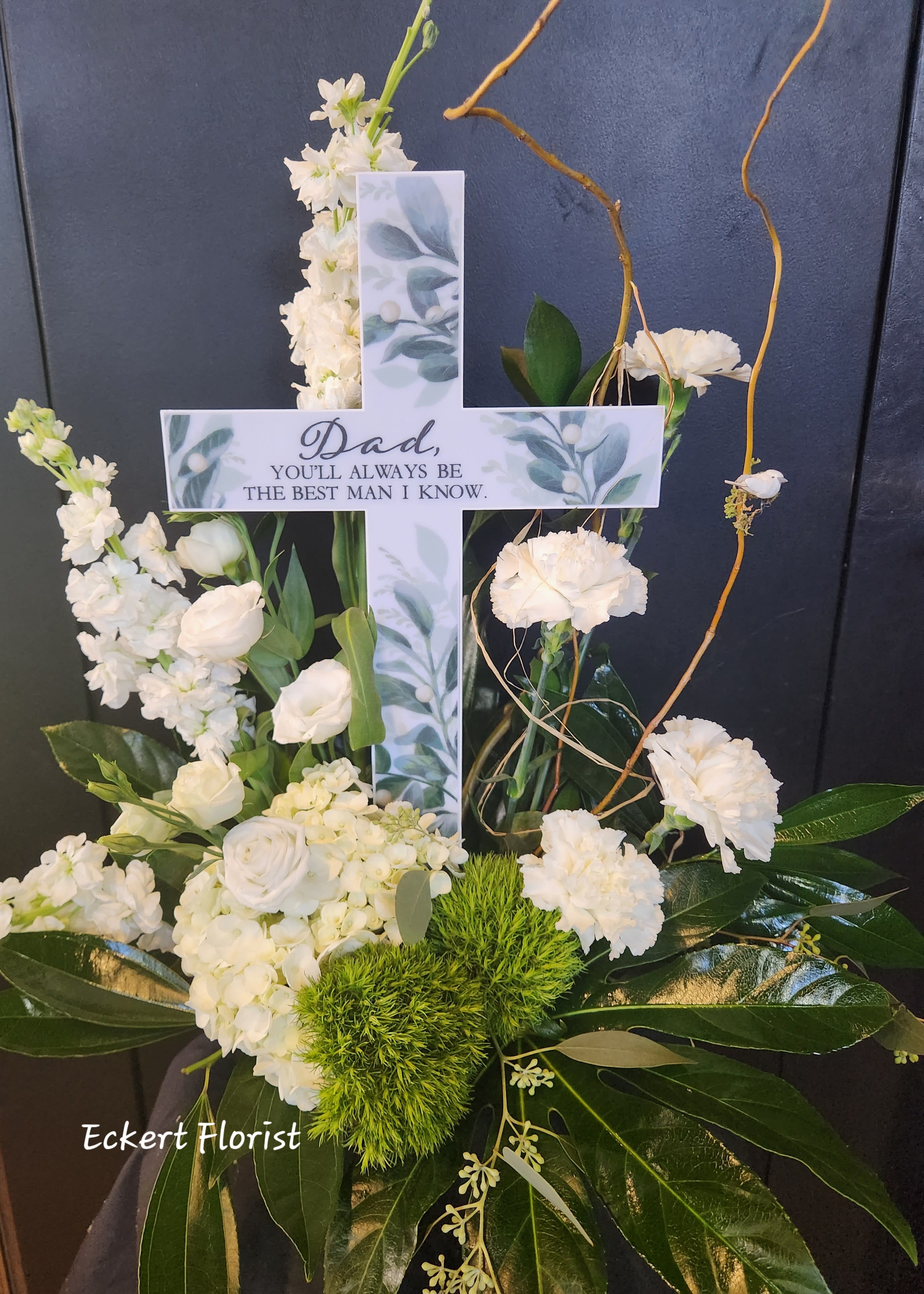 White floral cross with a memorial message for Dad