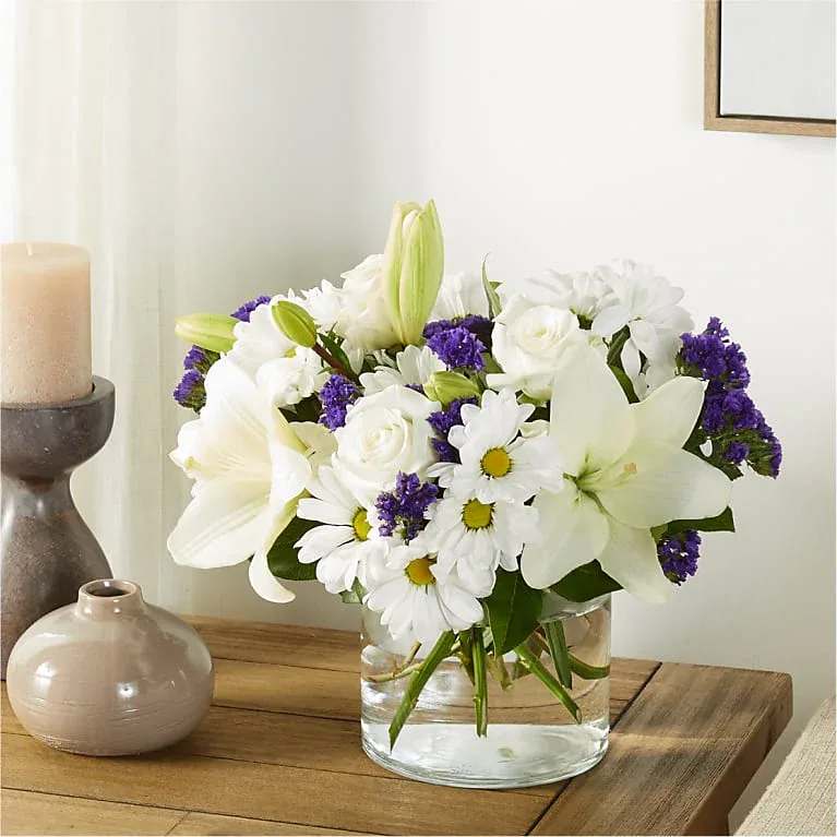 Eckert Florist's FTD Beyond Blue Bouquet - There is something about the shade of blue that brings a sense of calmness and serenity. Our Beyond Blue bouquet is designed with billowing white blooms and pops of bold florals to deliver just the right sentiment for any reason. *Flower variety and color may vary. 