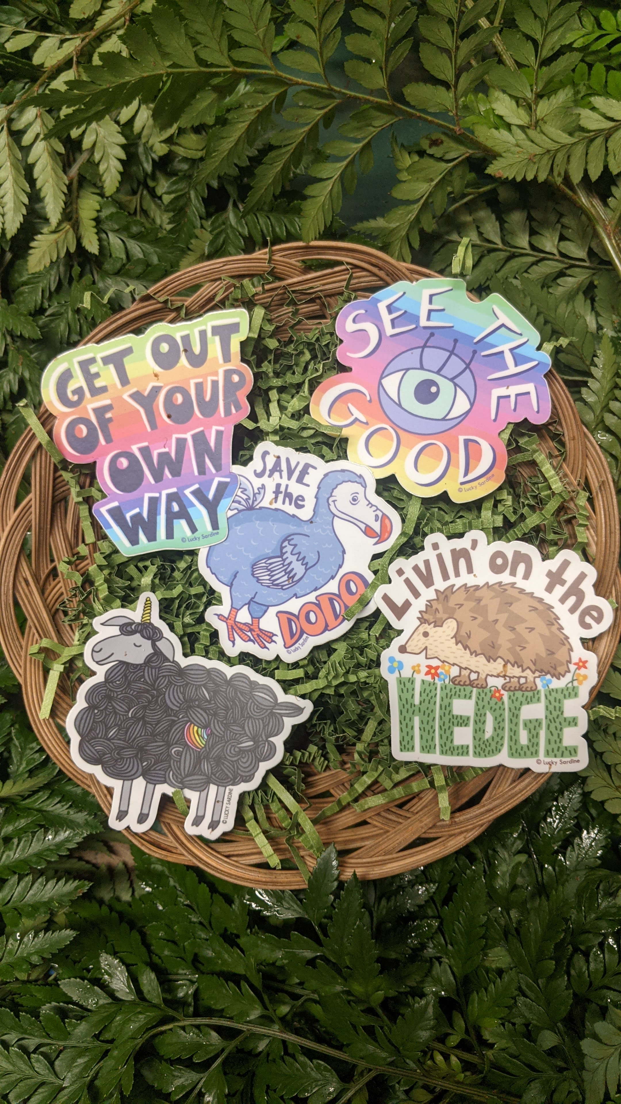Sticker set on a wicker tray over fern leaves