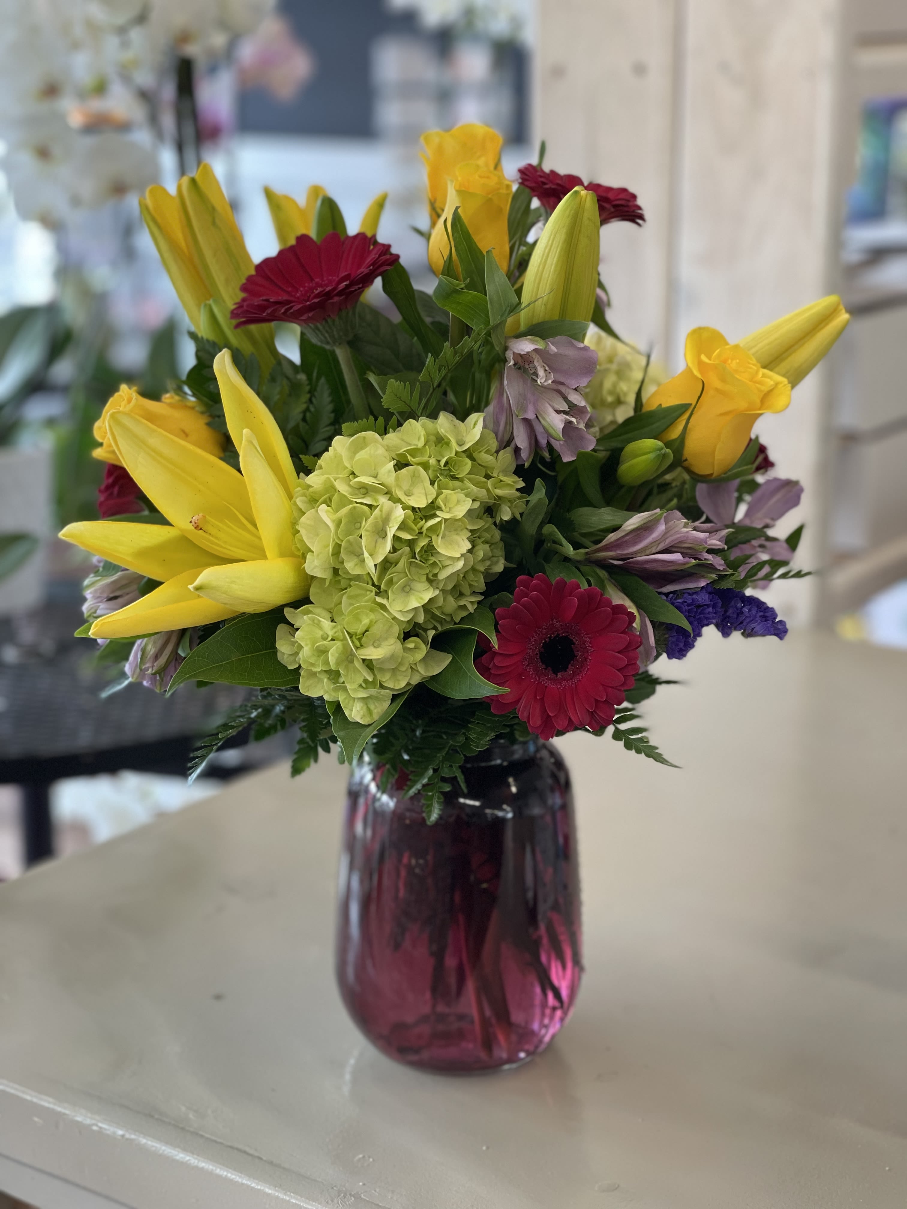 Summer loving - lilies, hydrangea, roses and gerbera daisies (Substitutions happen , with availability of flowers)