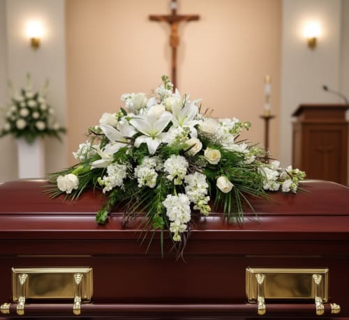 Lasting Memories  - Lasting Memory Casket Spray – Funeral Flowers in Tumwater, WA  Honor a cherished life with the Lasting Memory Casket Spray, an elegant tribute from Specialty Floral Design, your local florist in Tumwater, WA. This refined arrangement features a harmonious blend of pristine white lilies, delicate white roses, and fragrant white stock, creating a serene and timeless display for a funeral or memorial service.  Specialty Floral Design provides compassionate coordination with local funeral homes, including Mills &amp; Mills Funeral Home, Woodlawn Funeral Home, and Funeral Alternatives, ensuring your floral tribute arrives on time and with care.  Please note: lilies may require time to fully bloom. To ensure the arrangement looks its best, we recommend ordering at least a week in advance. If time is limited, our florists will substitute appropriate flowers to maintain the beauty and sentiment of the design.  We offer prompt flower delivery throughout Thurston County, including Olympia, Tumwater, and Lacey, WA. Each arrangement is handcrafted with attention to detail, creating a meaningful tribute that conveys your deepest condolences and celebrates the lasting memories of your loved one. 