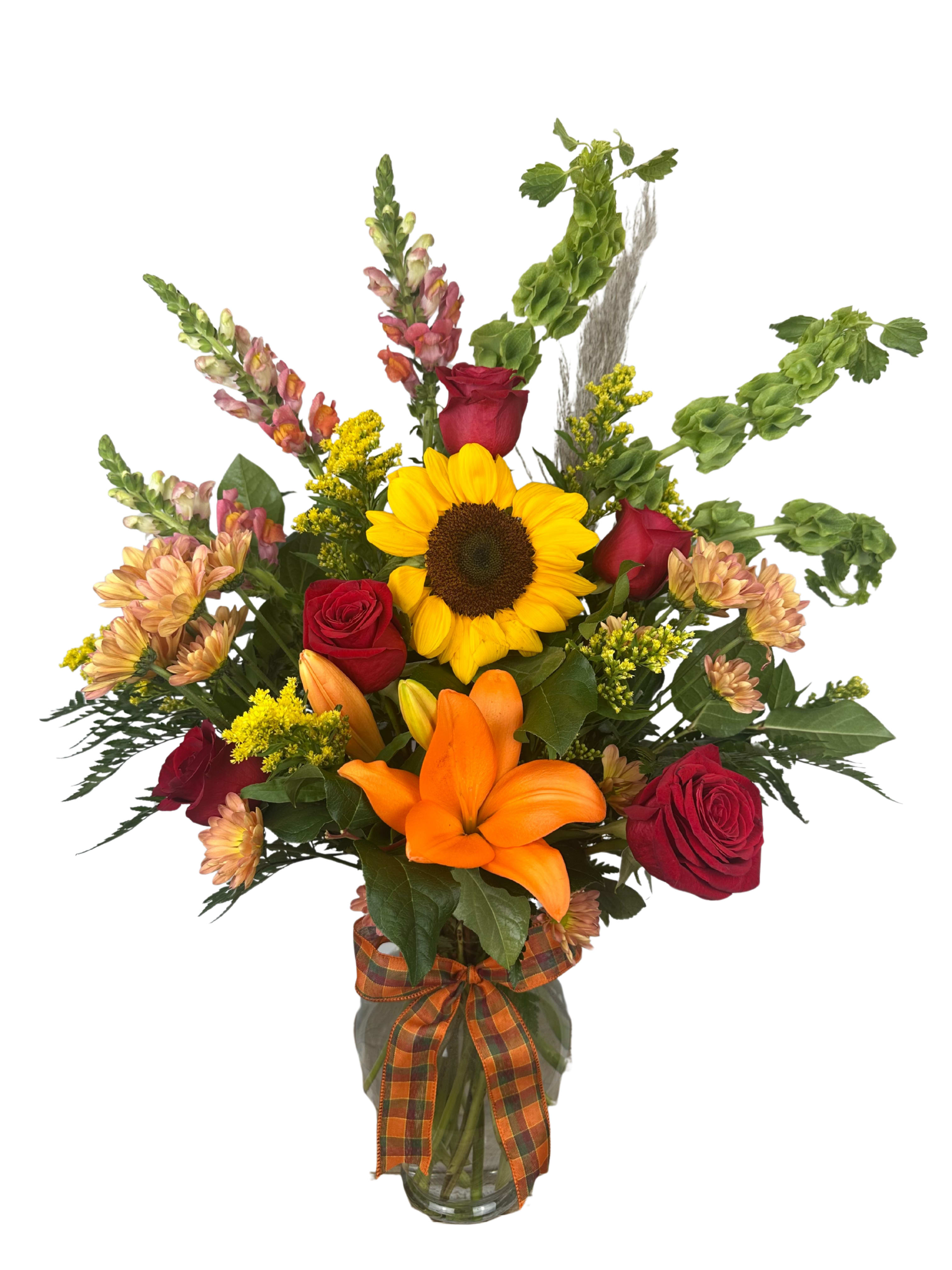 Sunflower and red rose bouquet in a glass vase with an orange ribbon