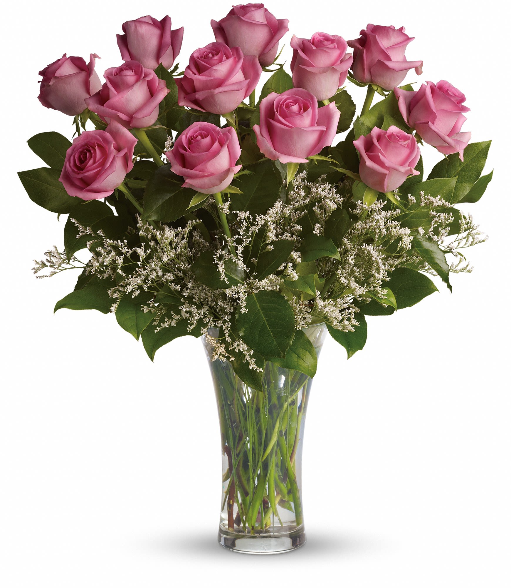 Pink roses arranged in a clear glass vase