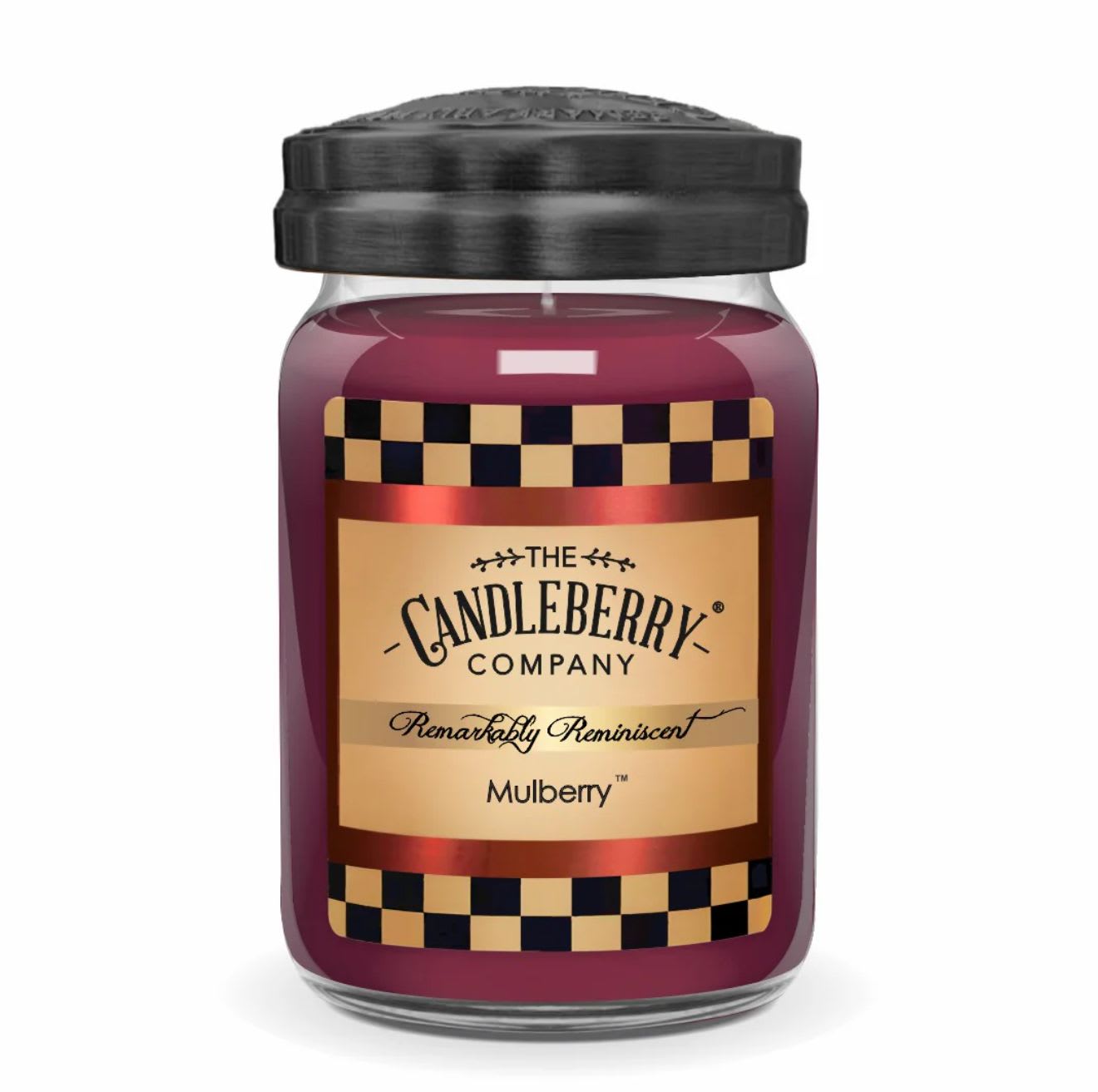 Purple candle in a glass jar with a black lid and label