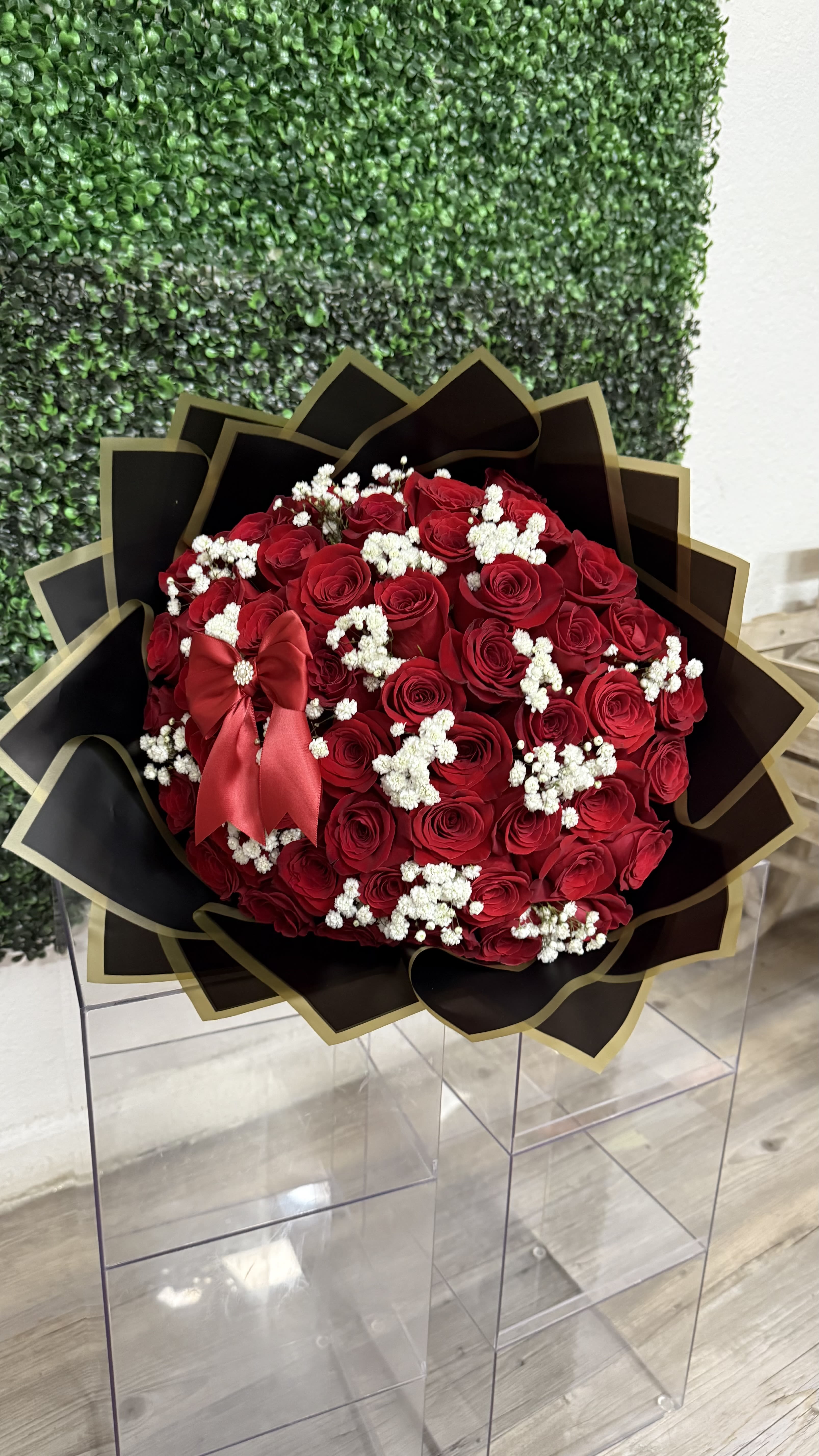 Eternal Red Elegance  - 50 long stem Red roses with a touch of baby's breath, this arrangement is perfect for any and all occasions