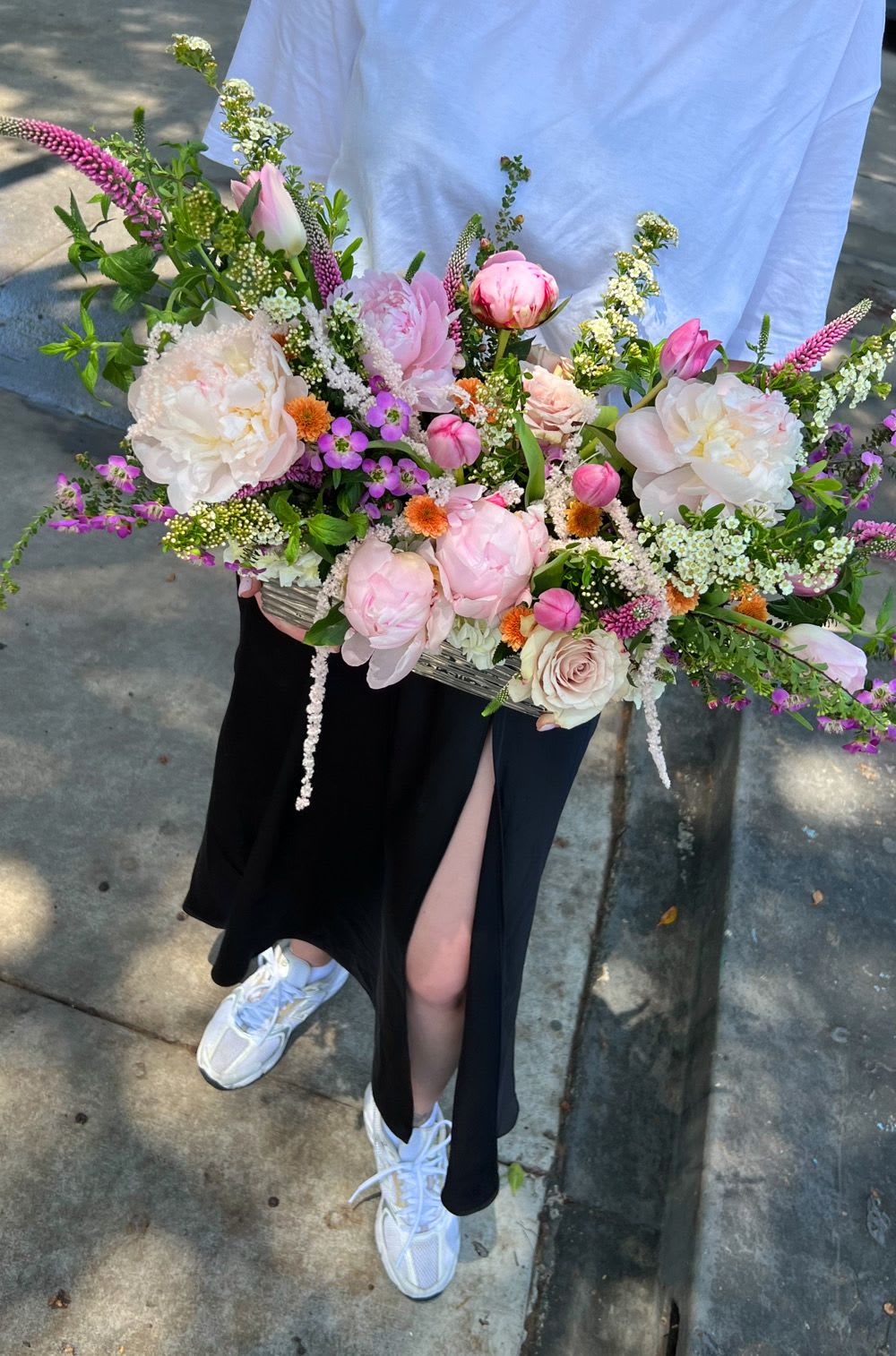 Large pastel bouquet with pink and white flowers in a rectangular container