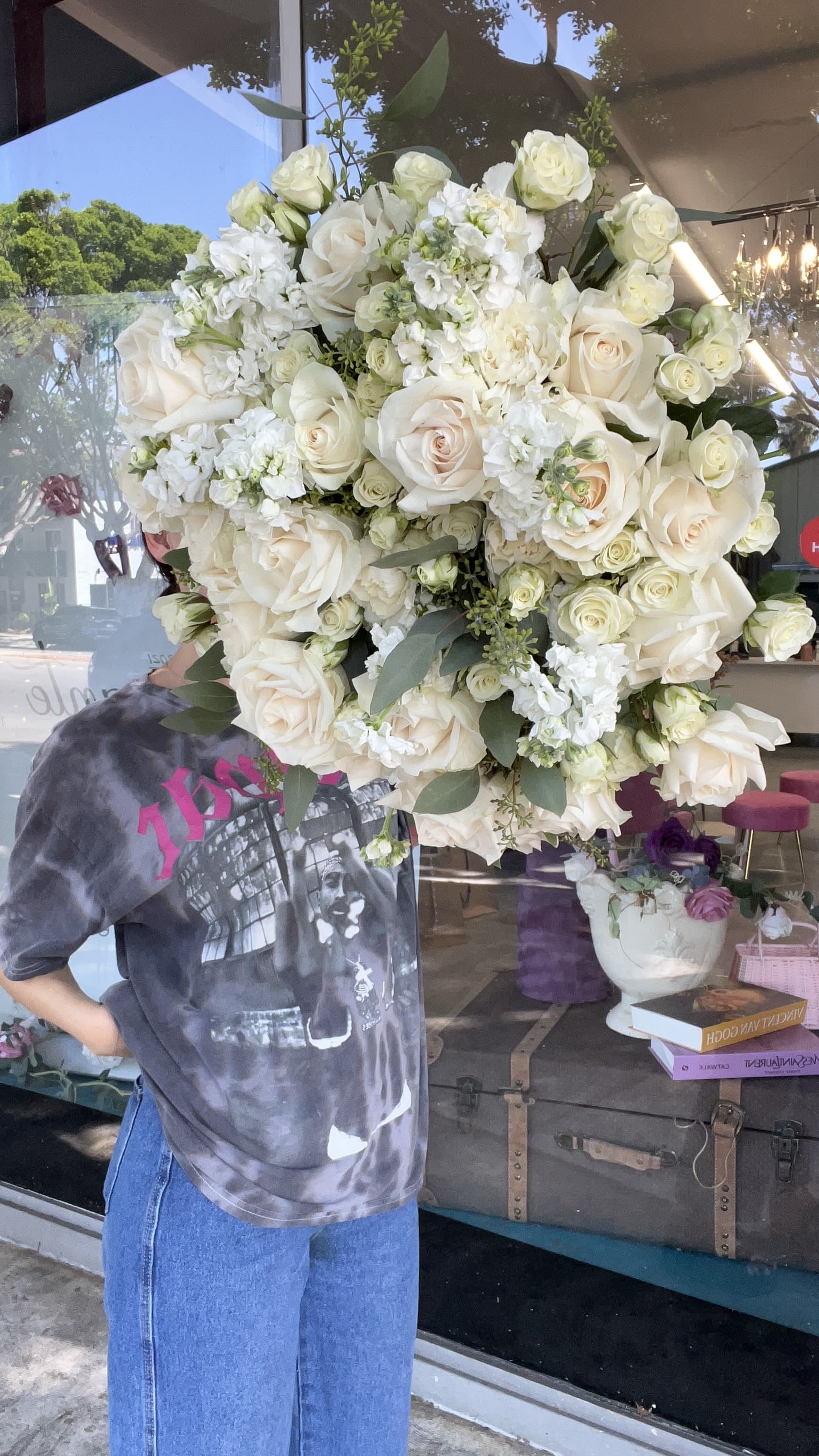 Large bouquet of white roses and white flowers with greenery