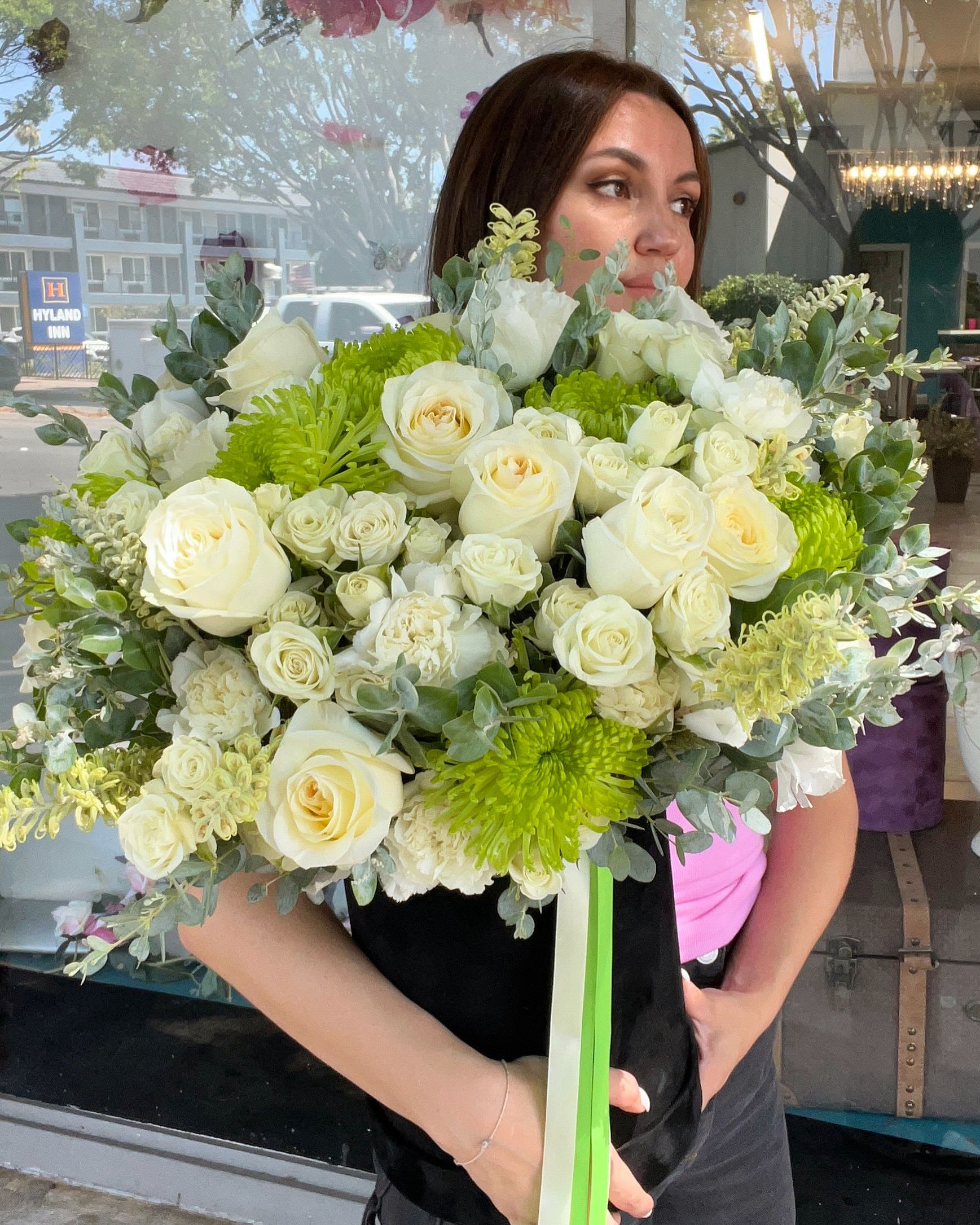 Large bouquet of white roses and green chrysanthemums with eucalyptus