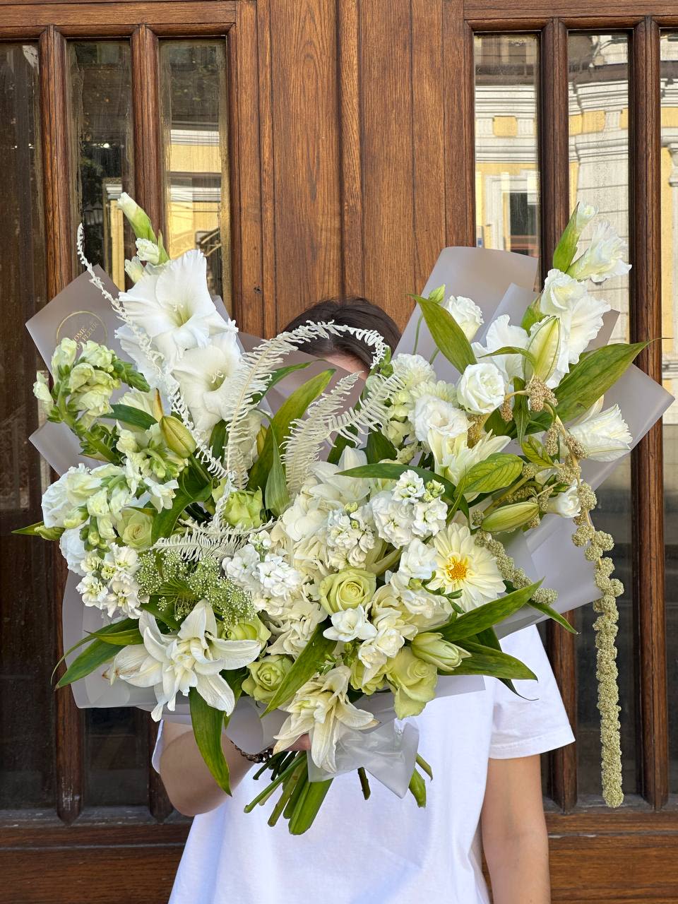 Large white bouquet with lilies, roses, and mixed blooms