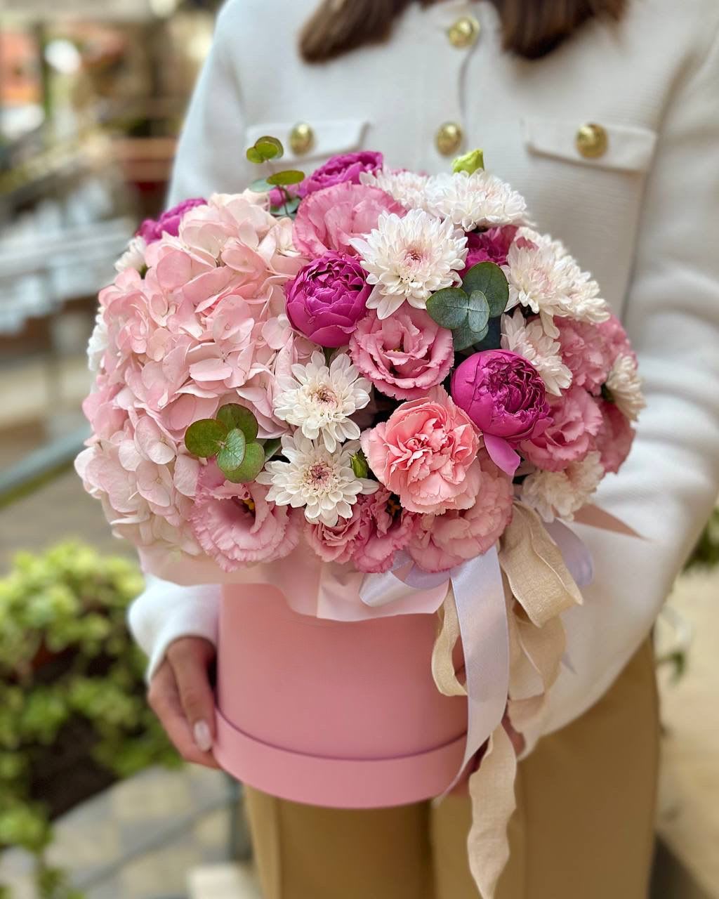 Pink and white bouquet in a pink hat box with ribbon