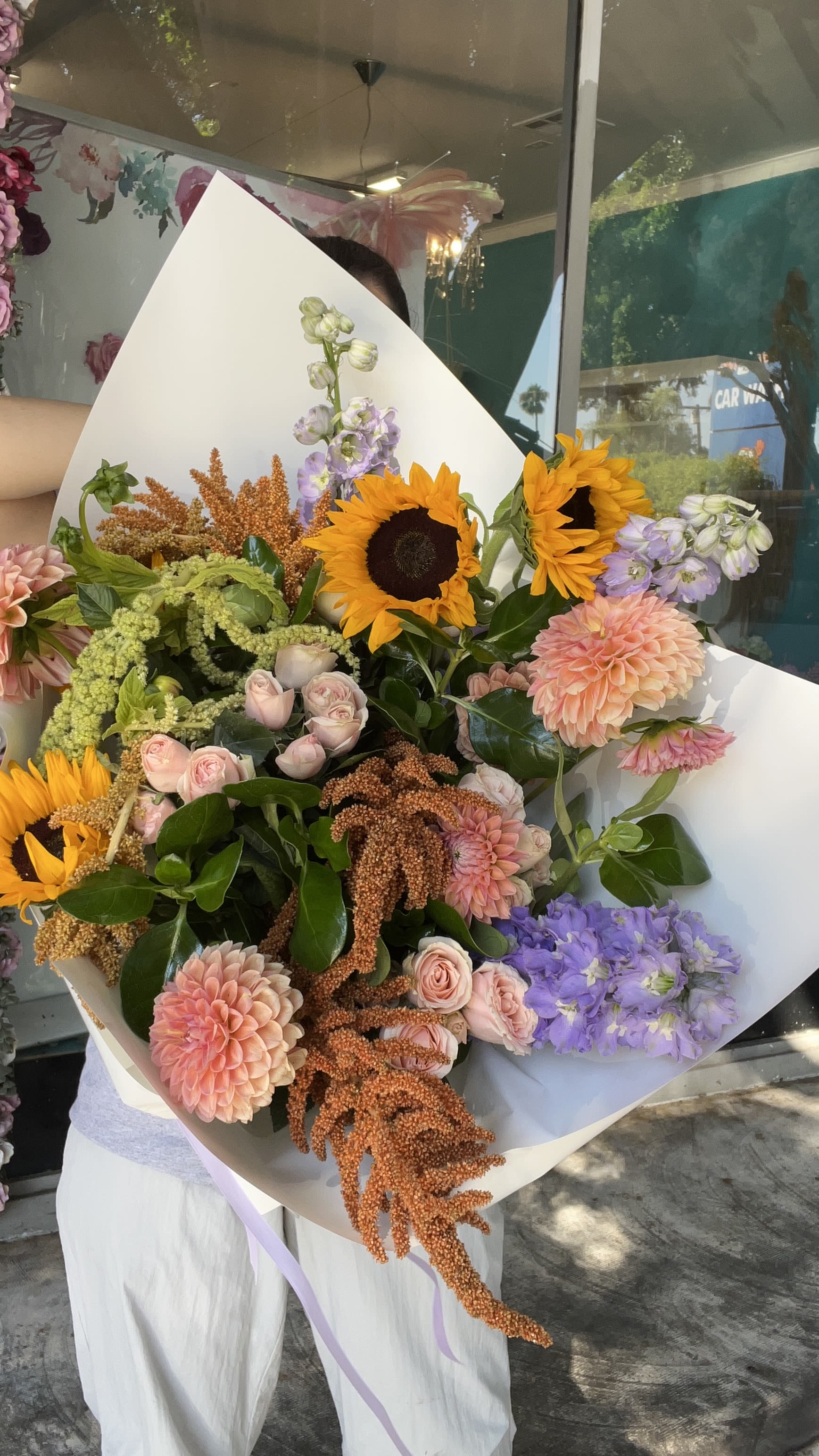 Large mixed bouquet with sunflowers, pink dahlias, and lavender blooms