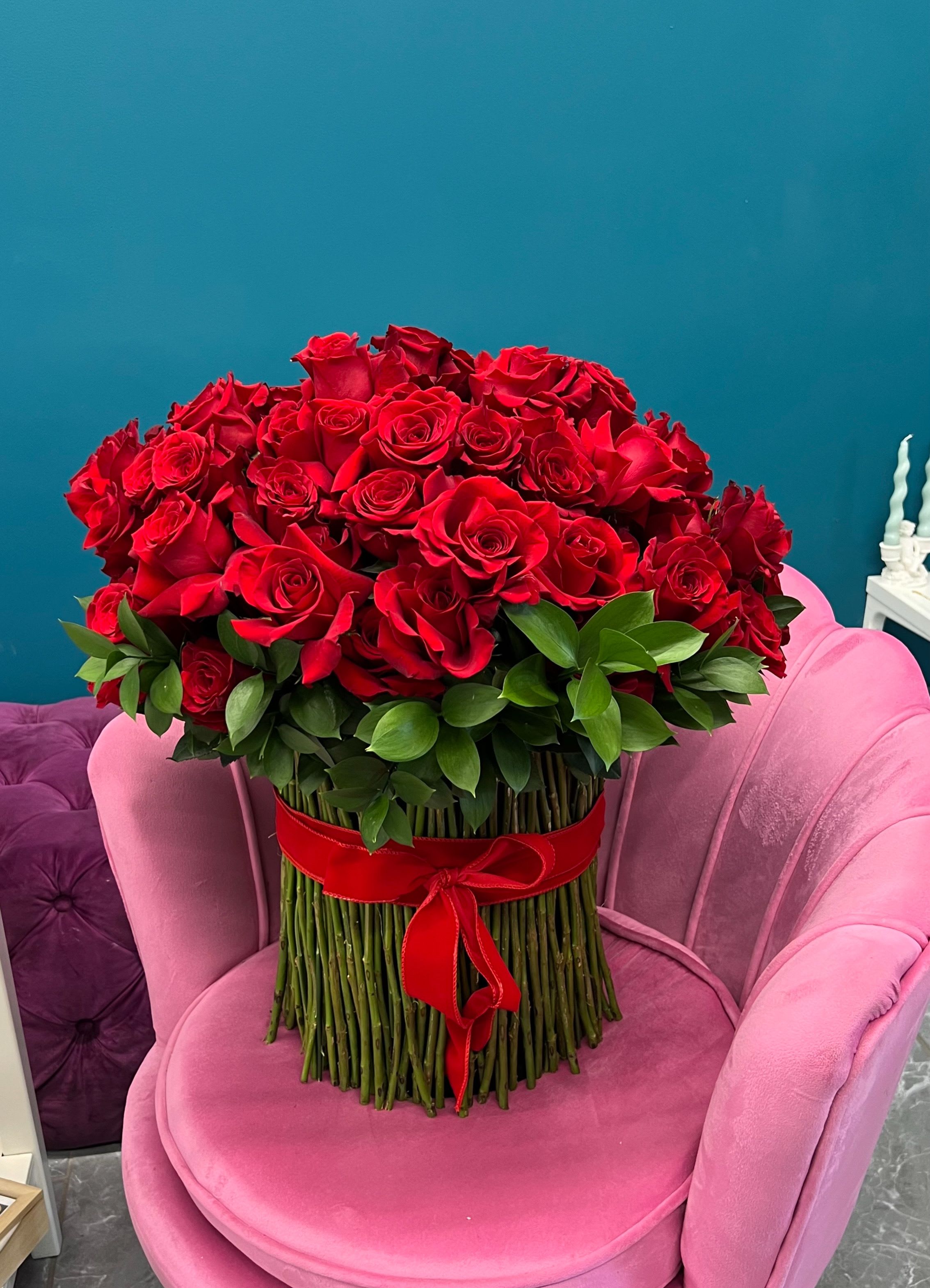 Large bouquet of red roses with a red ribbon