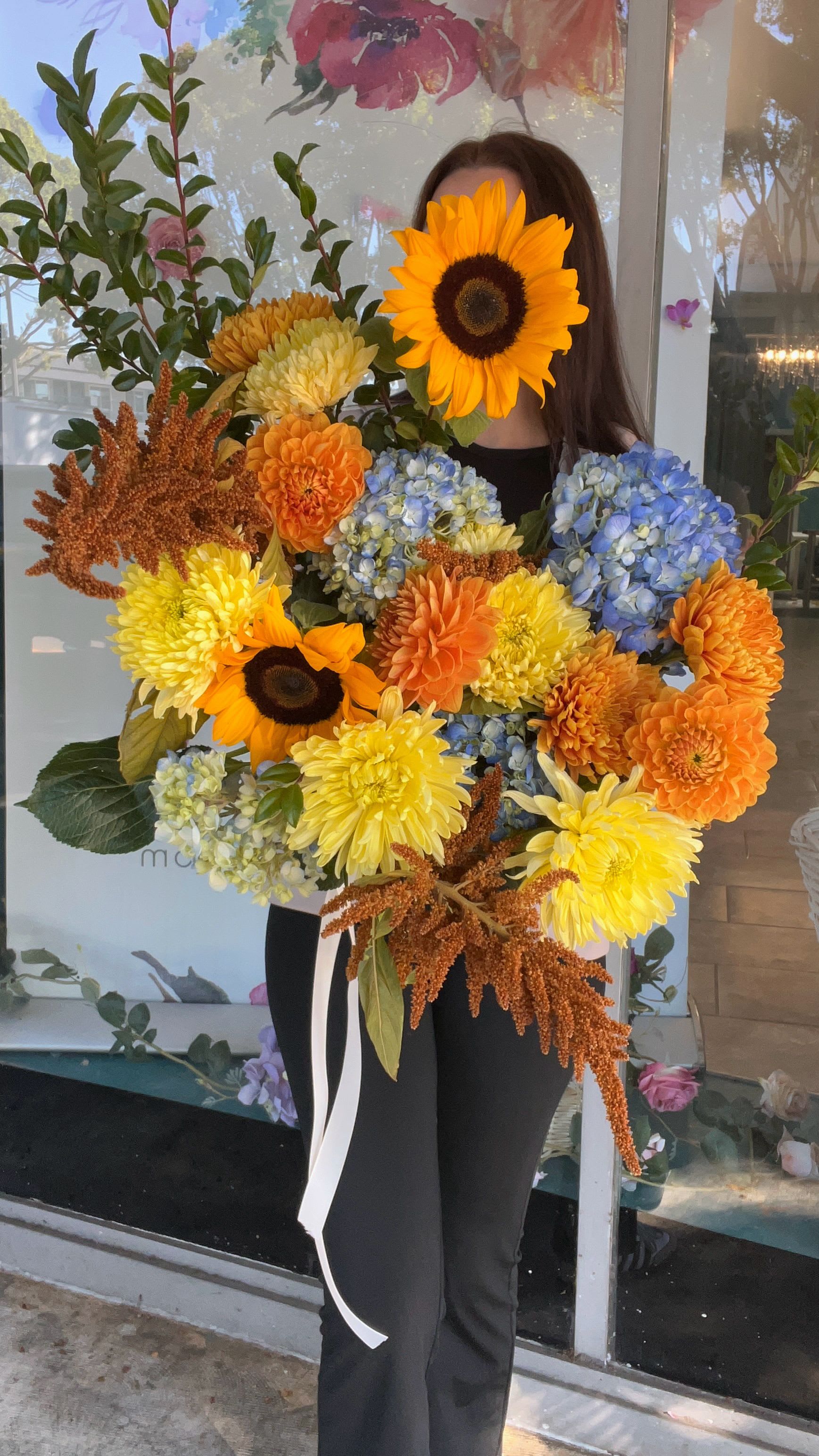 Large bouquet with sunflowers, dahlias, hydrangeas, and orange blooms