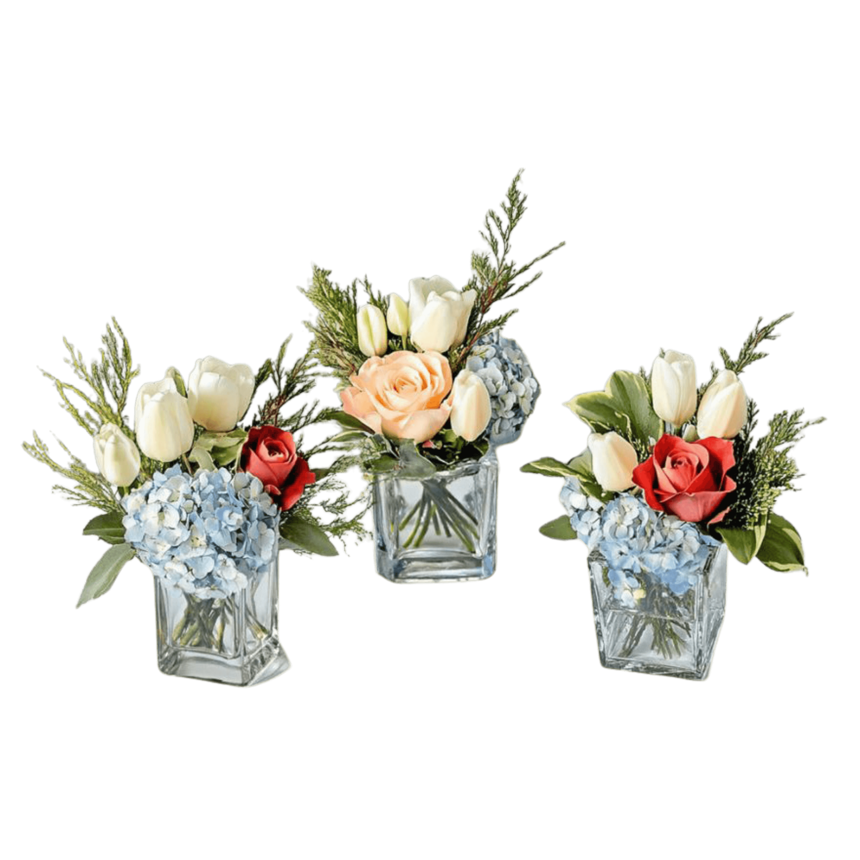 Three small floral arrangements in square glass vases with tulips, roses, and hydrangeas.