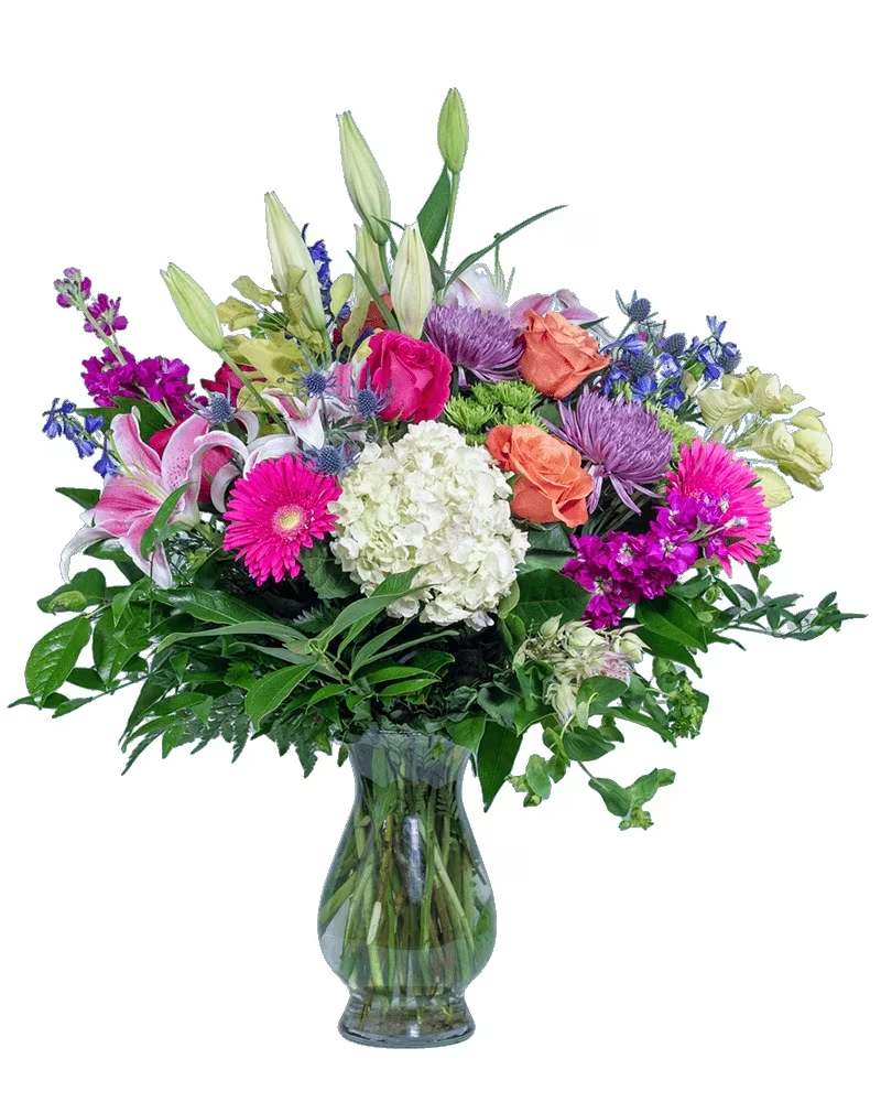 Love You to the Moon - They rock your world. Love You to the Moon will express your devotion. A white hydrangea takes center "space" among stargazers, roses, and other flowers in our Bella vase. 