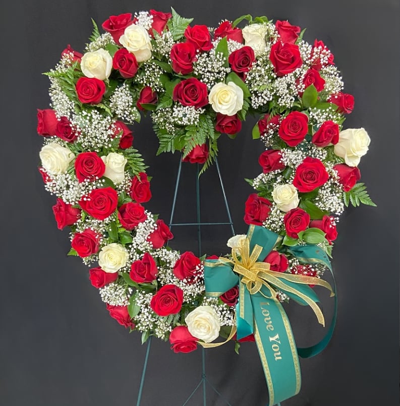 Love Blooms Eternal Open Heart Wreath - Bid a fond farewell to loved one lost with this elegant 24" oasis heart mounted covered in red and white roses and baby's breath mounted on a 54inch standing easel.