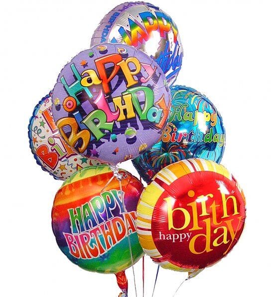 Cluster of colorful round Happy Birthday foil balloons